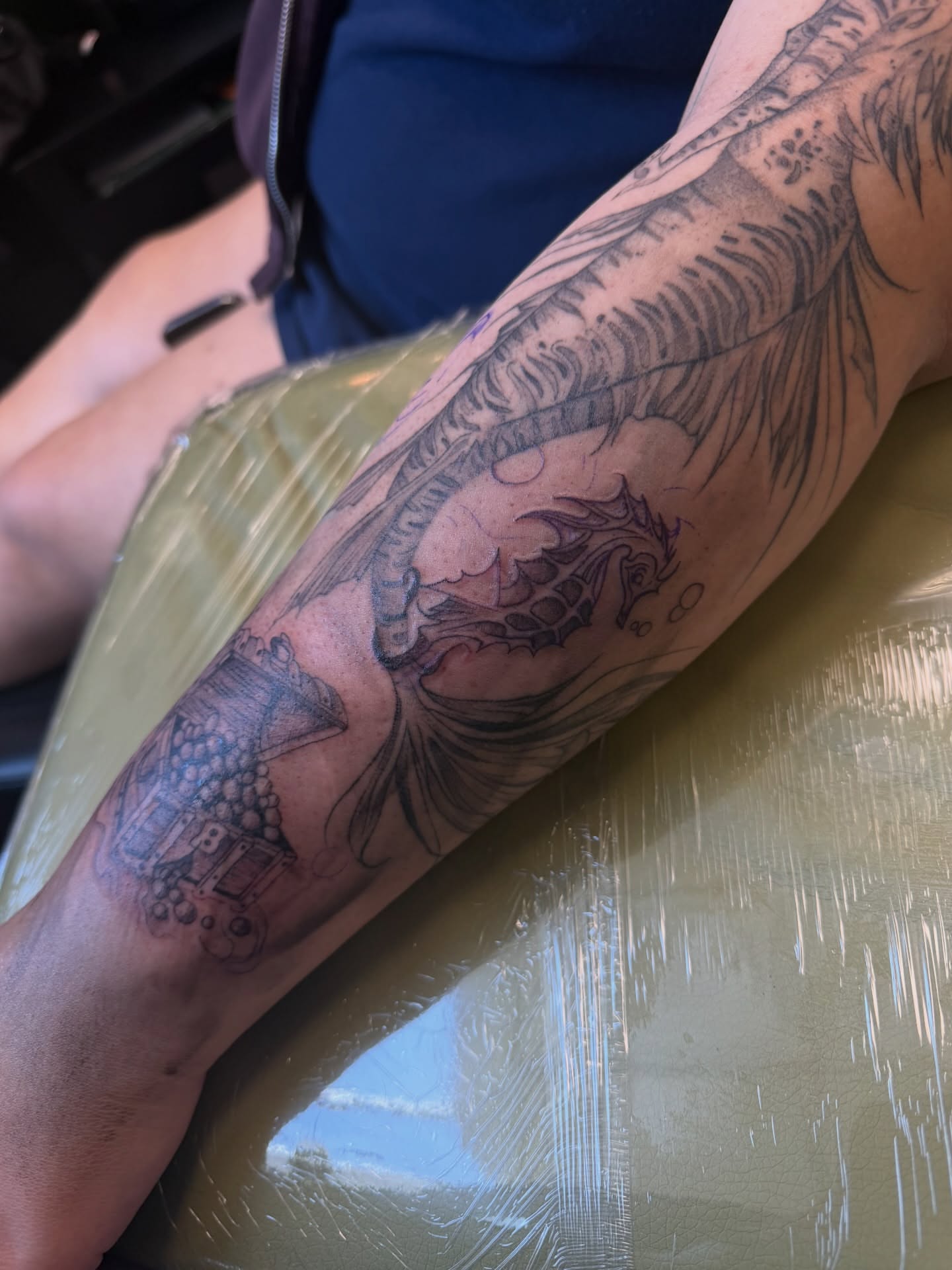 Dragon and ship black and grey tattoo on the forearm by ashlyn rene