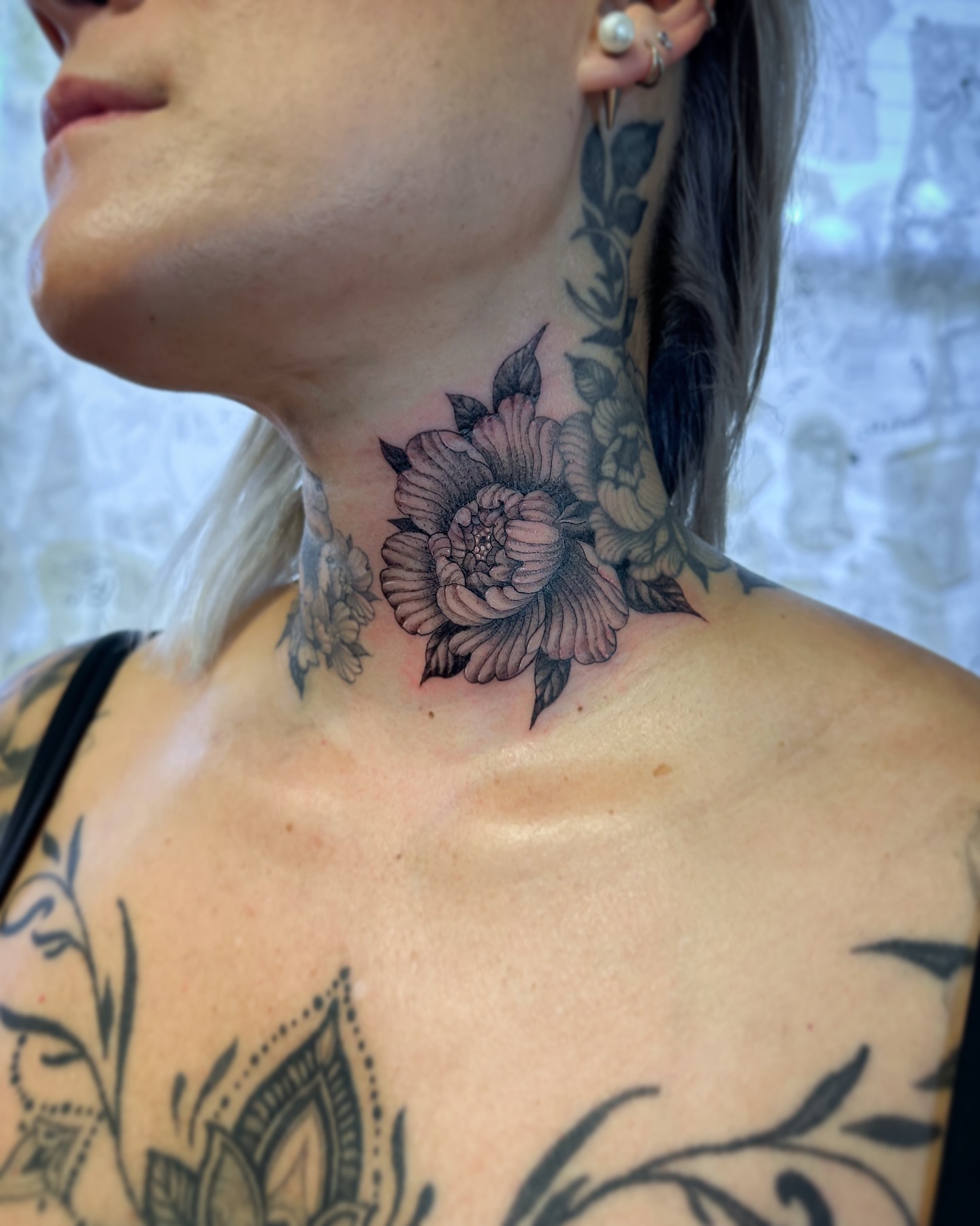 Floral black and grey tattoo on the neck by Colin Kenji Baker, San Jose, California
