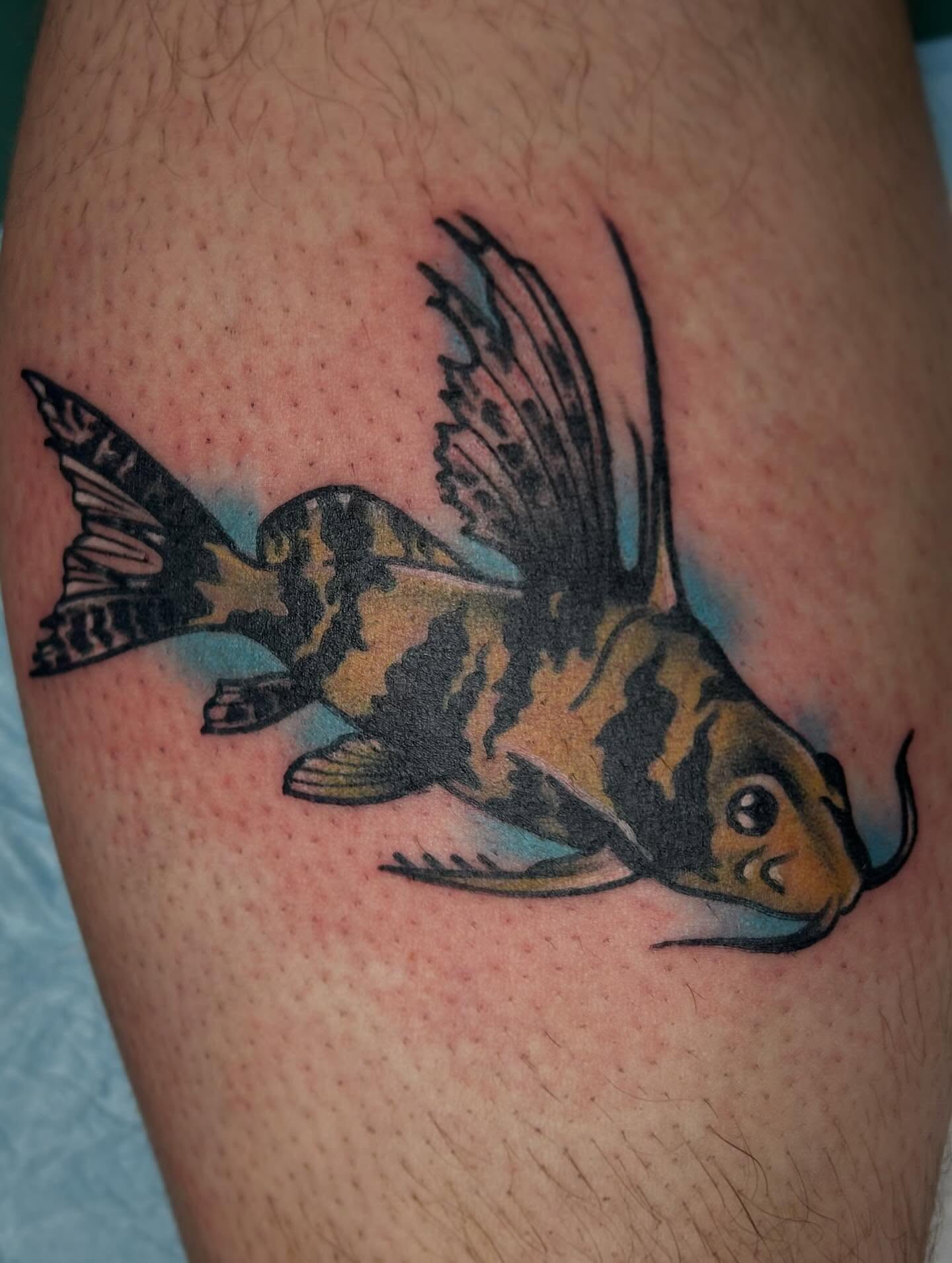 Fish watercolor tattoo on the thigh by Morgan Hazer Tattoos, Cedar Rapids, Iowa
