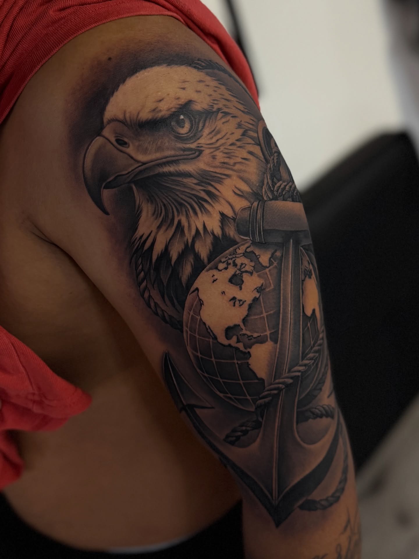 Eagle realism tattoo on the upper arm by Rocky G Inkz LLC