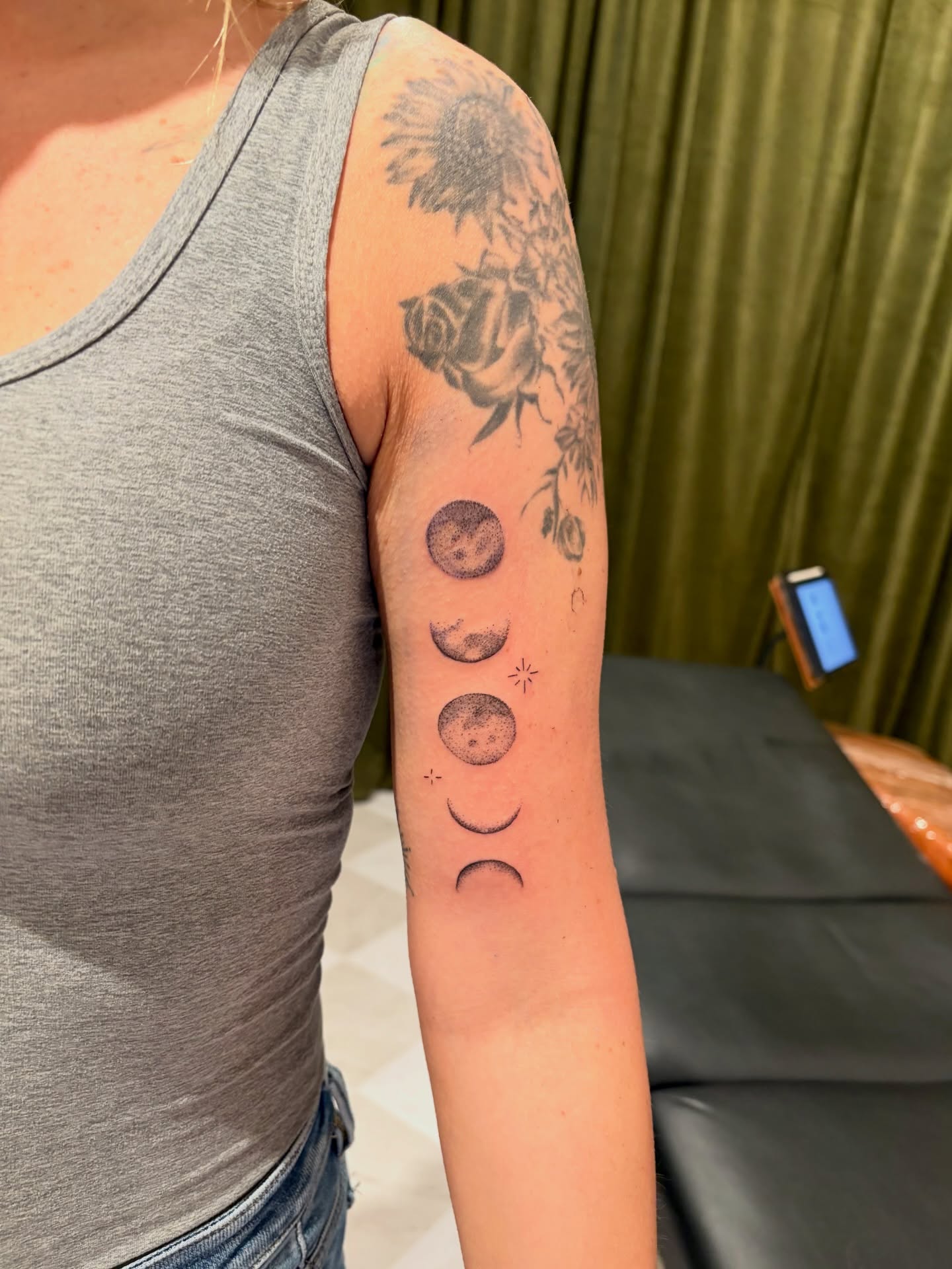 Moon phases dotwork tattoo on the forearm by Emily, Monticello, Iowa