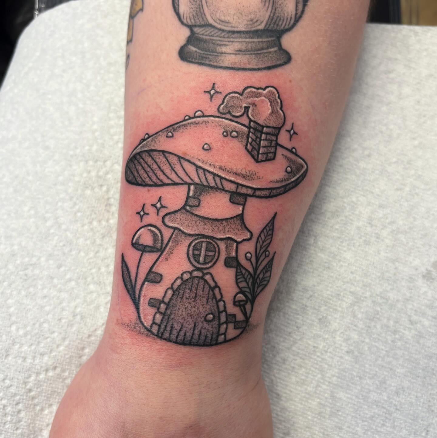 Mushroom house black and grey tattoo on the forearm by Demi Flores 🖤