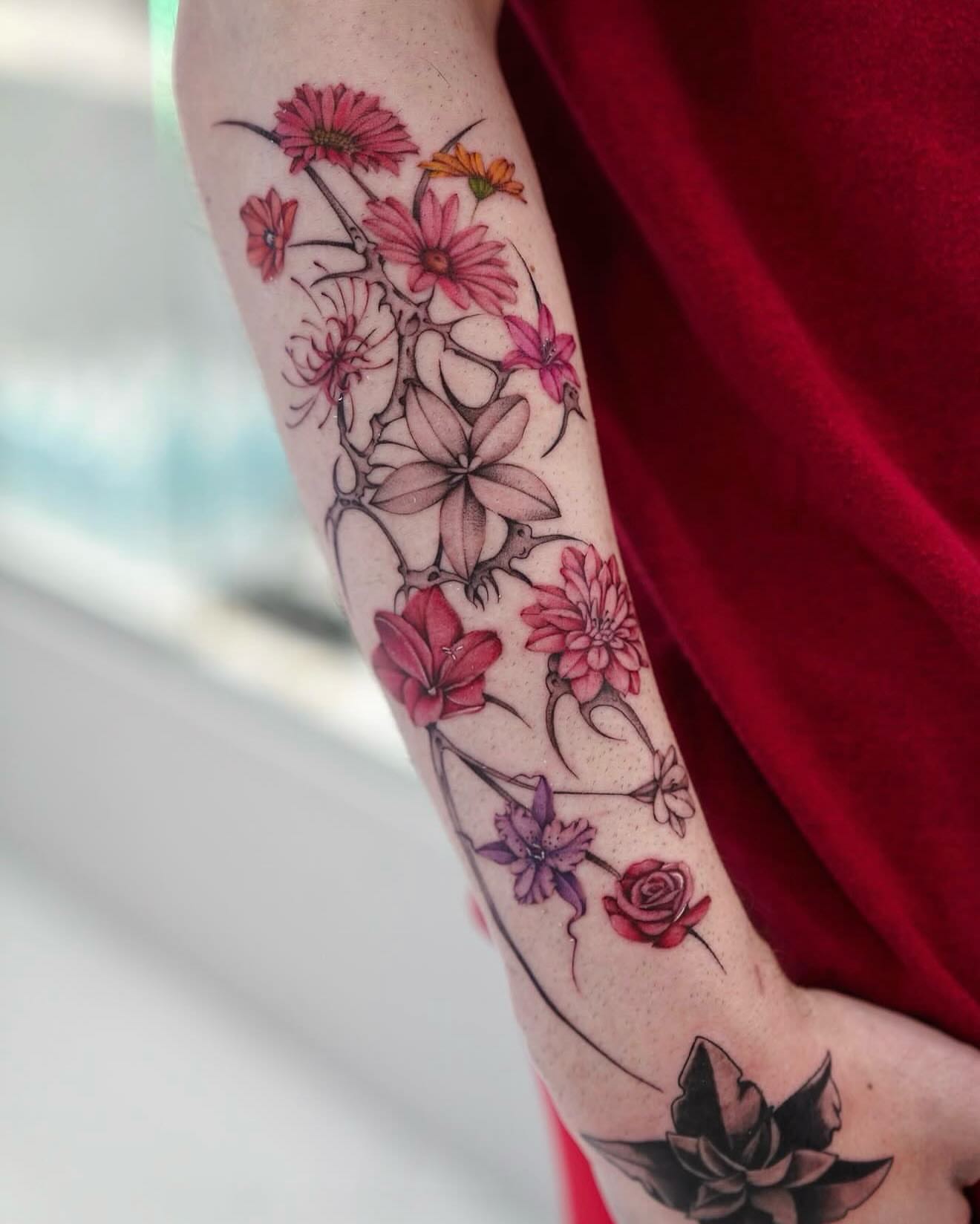 Floral arrangement new school tattoo on the forearm by Raytattooist