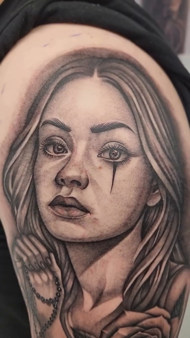 Woman with roses realism tattoo by professional tattoo artist