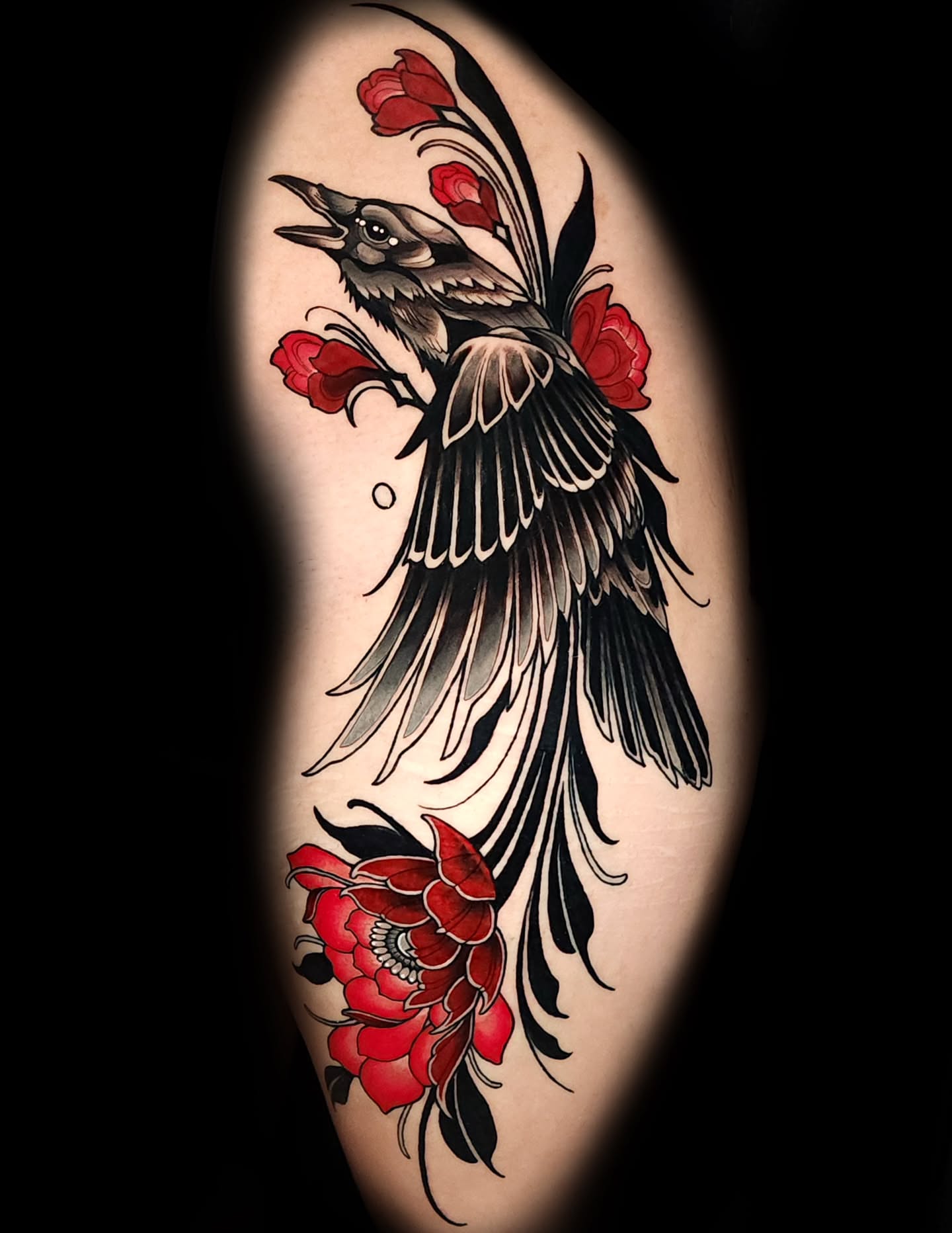 Bird and roses American traditional tattoo on the thigh by Mario Romero