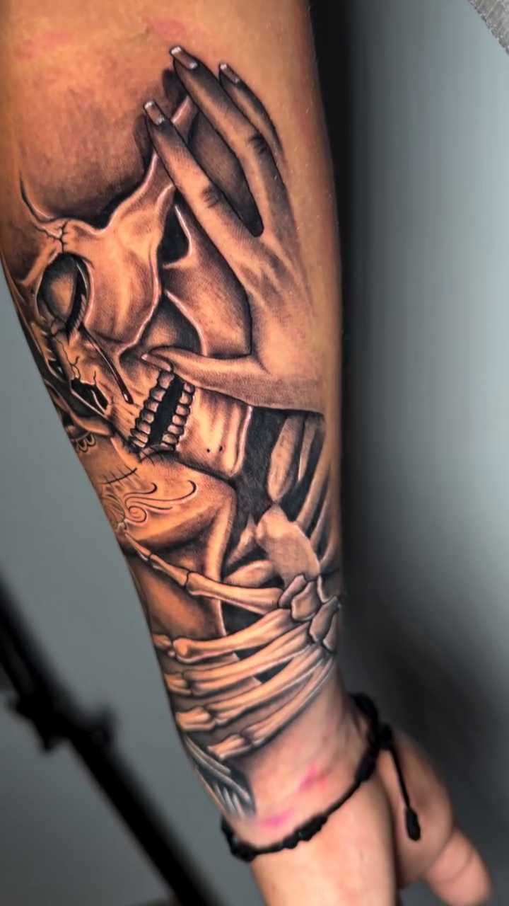 Skulls and praying hands dark realism tattoo by professional tattoo artist