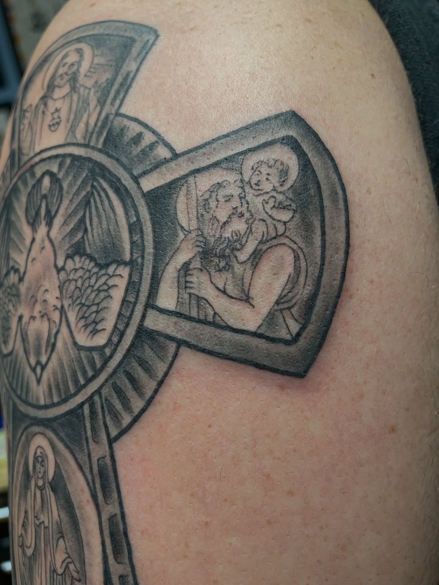 Religious figures black and grey tattoo on the shoulder by Kimber Teatro, Portland, Oregon