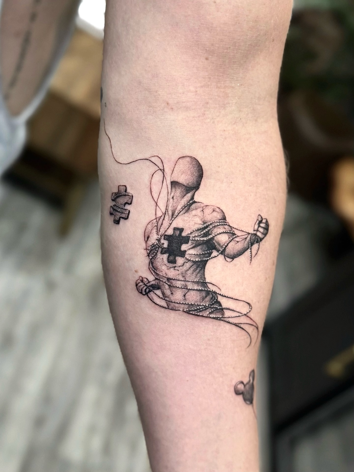 Astronaut black and grey tattoo on the forearm by Miro Ink Tattoo