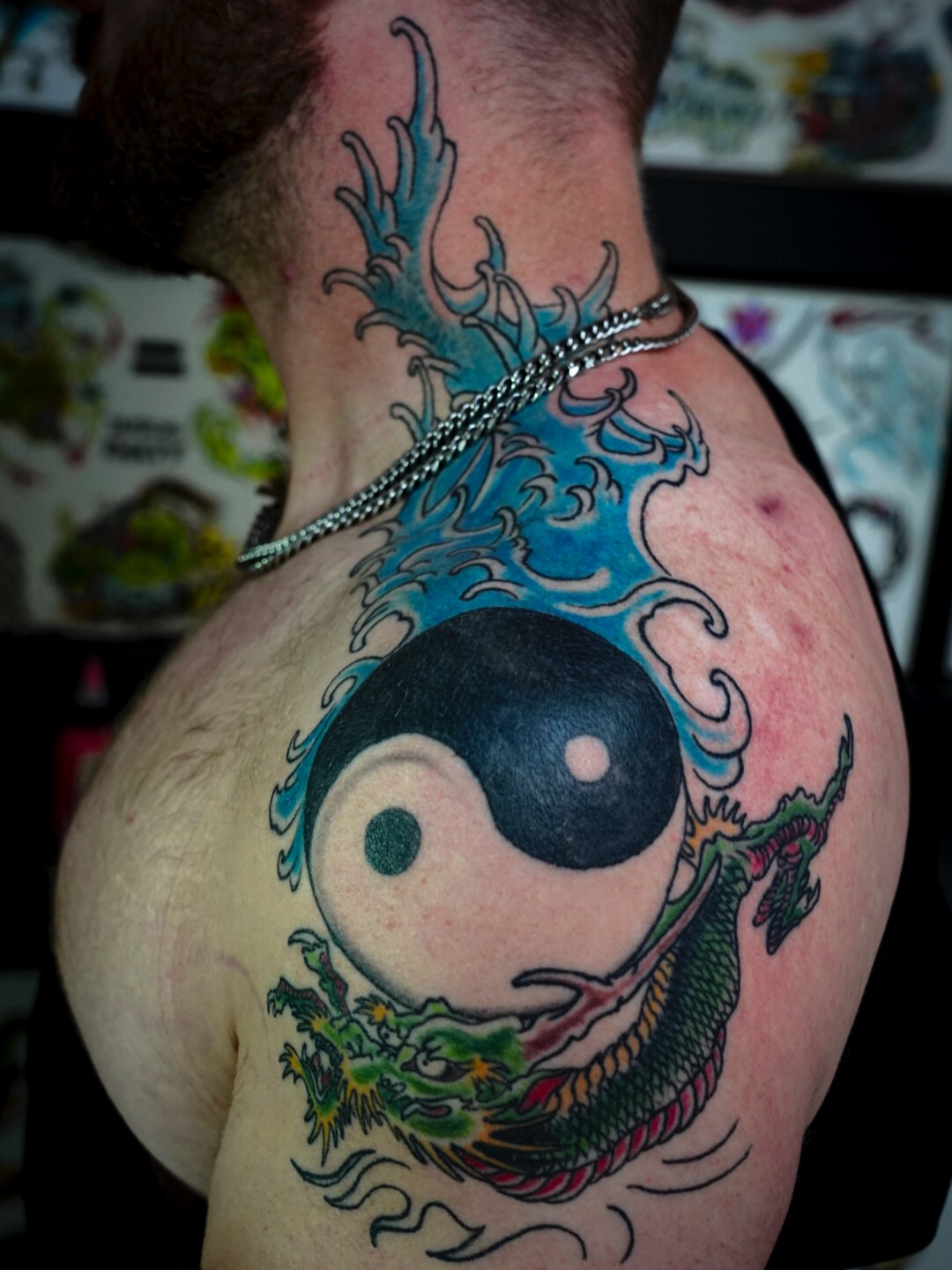 Yin yang with dragon American traditional tattoo on the shoulder by Spicoli