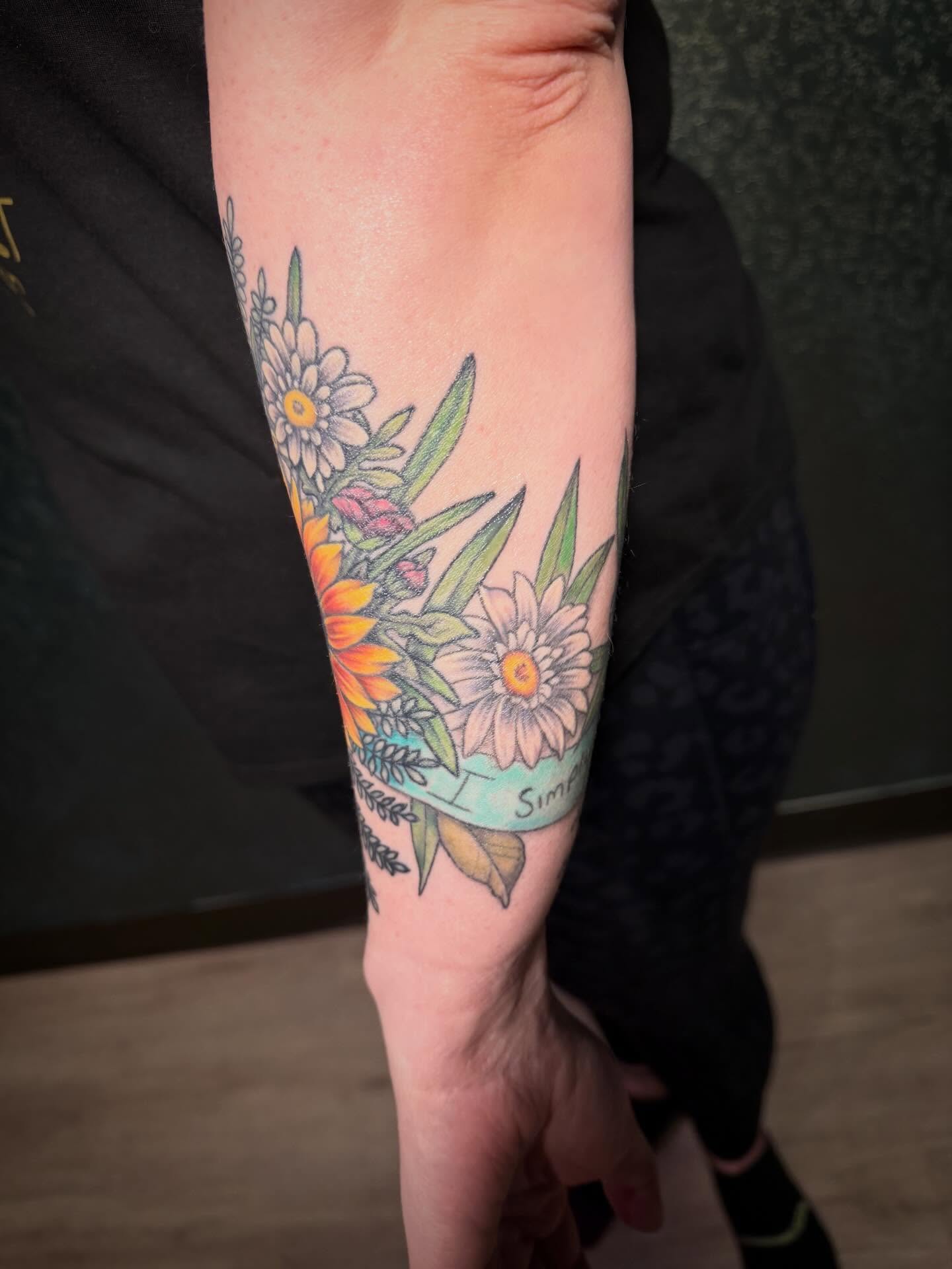 Floral bouquet new school tattoo on the forearm by Shelly Elissa Tattoos