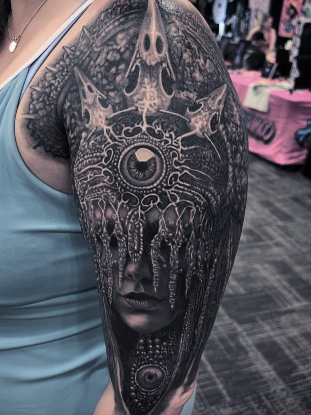Surreal portrait with crown and eye realism tattoo on the shoulder by Gabriel Londis