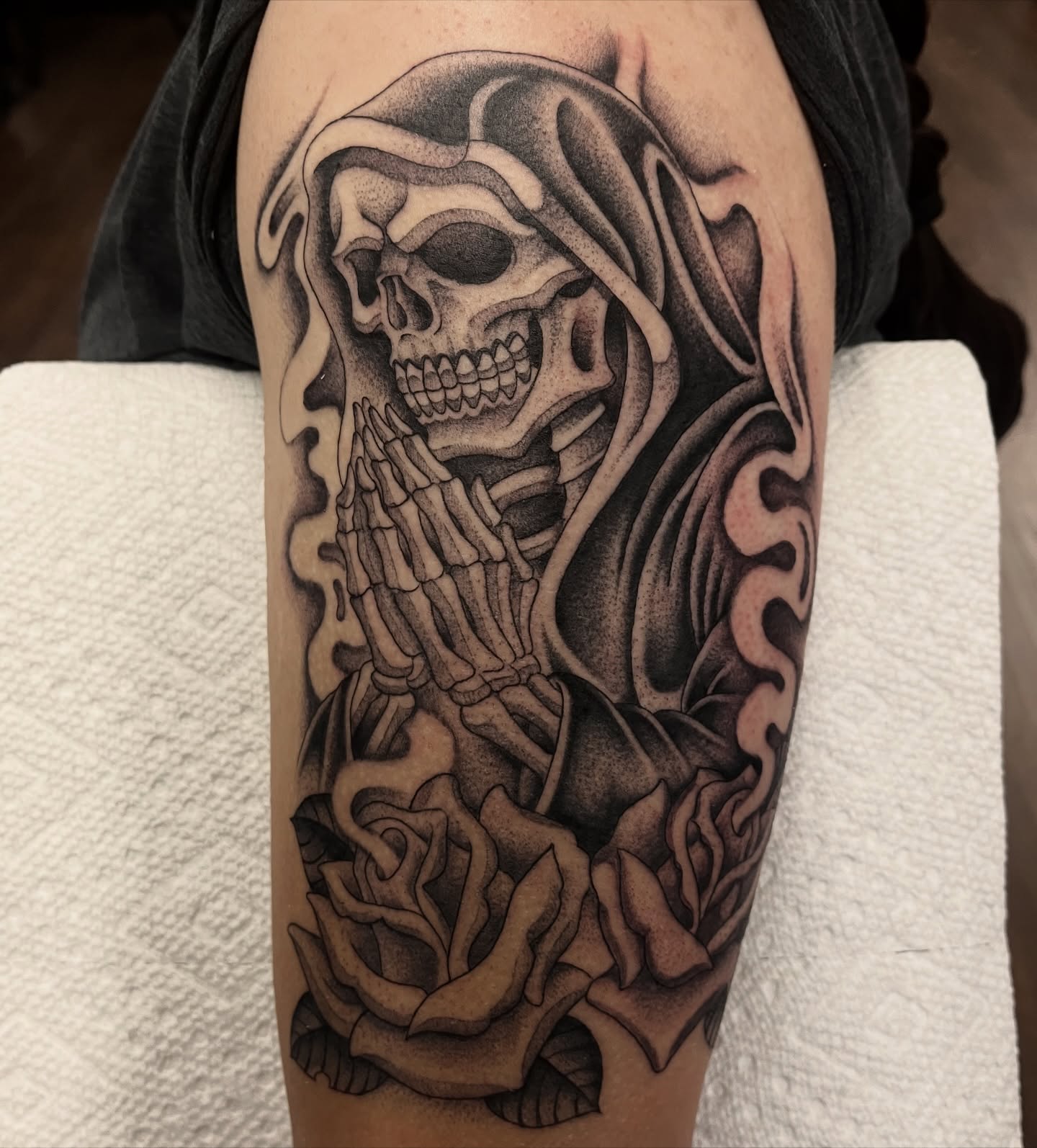 Reaper with roses realism tattoo on the forearm by Jesus Pieces