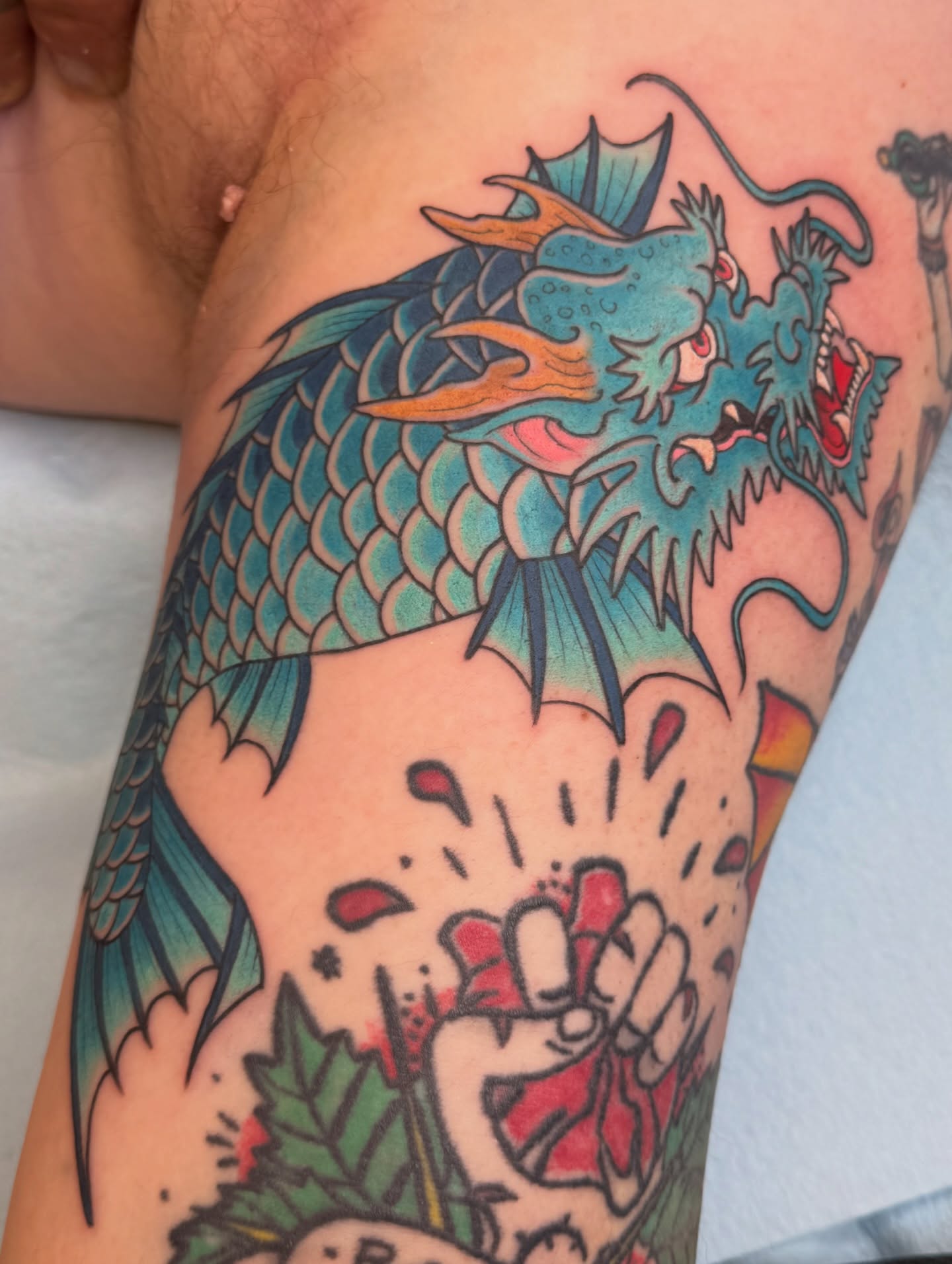 Dragon American traditional tattoo on the forearm by Anna Wall