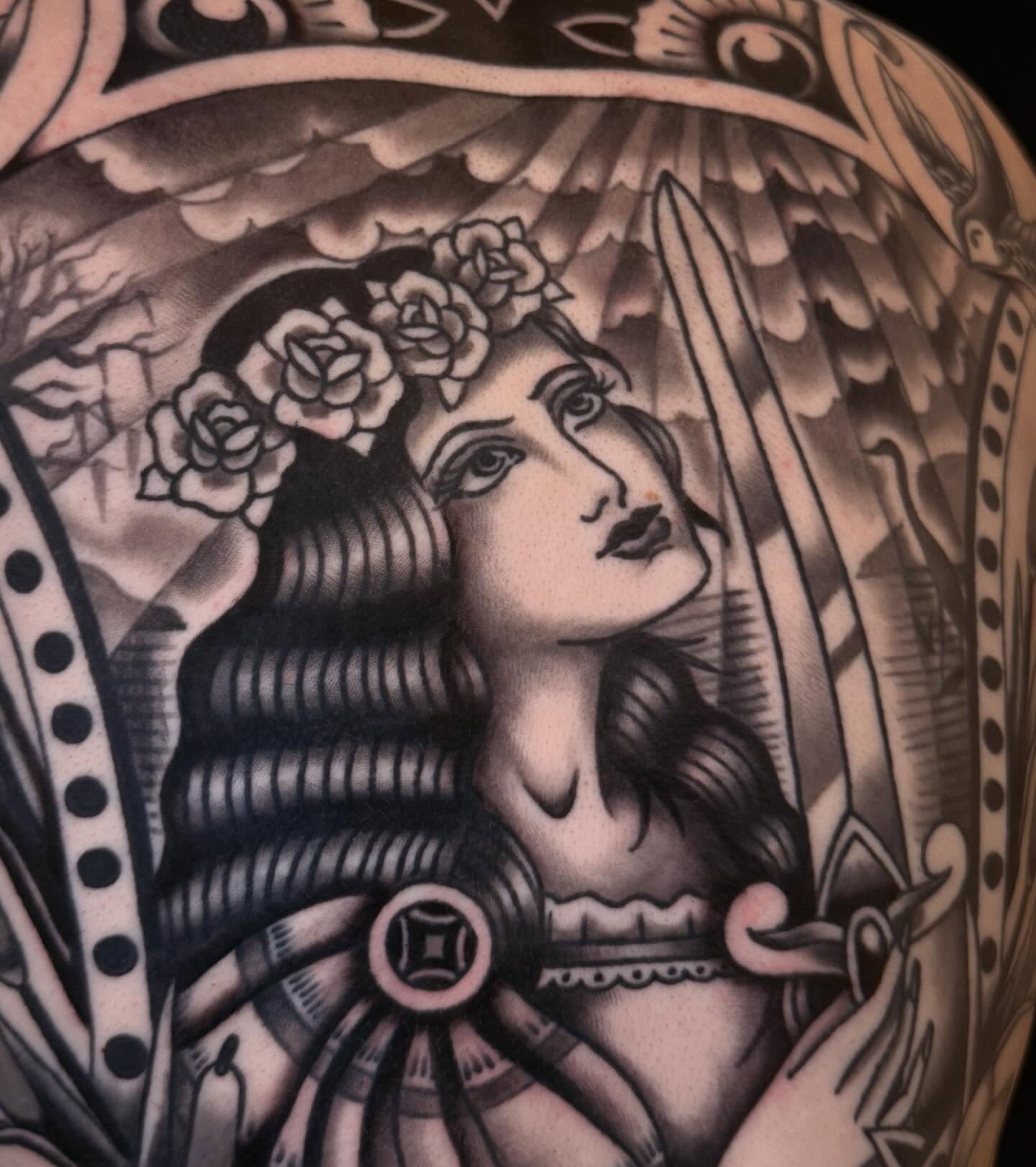 Woman with roses illustrative tattoo on the shoulder by Cory Allen