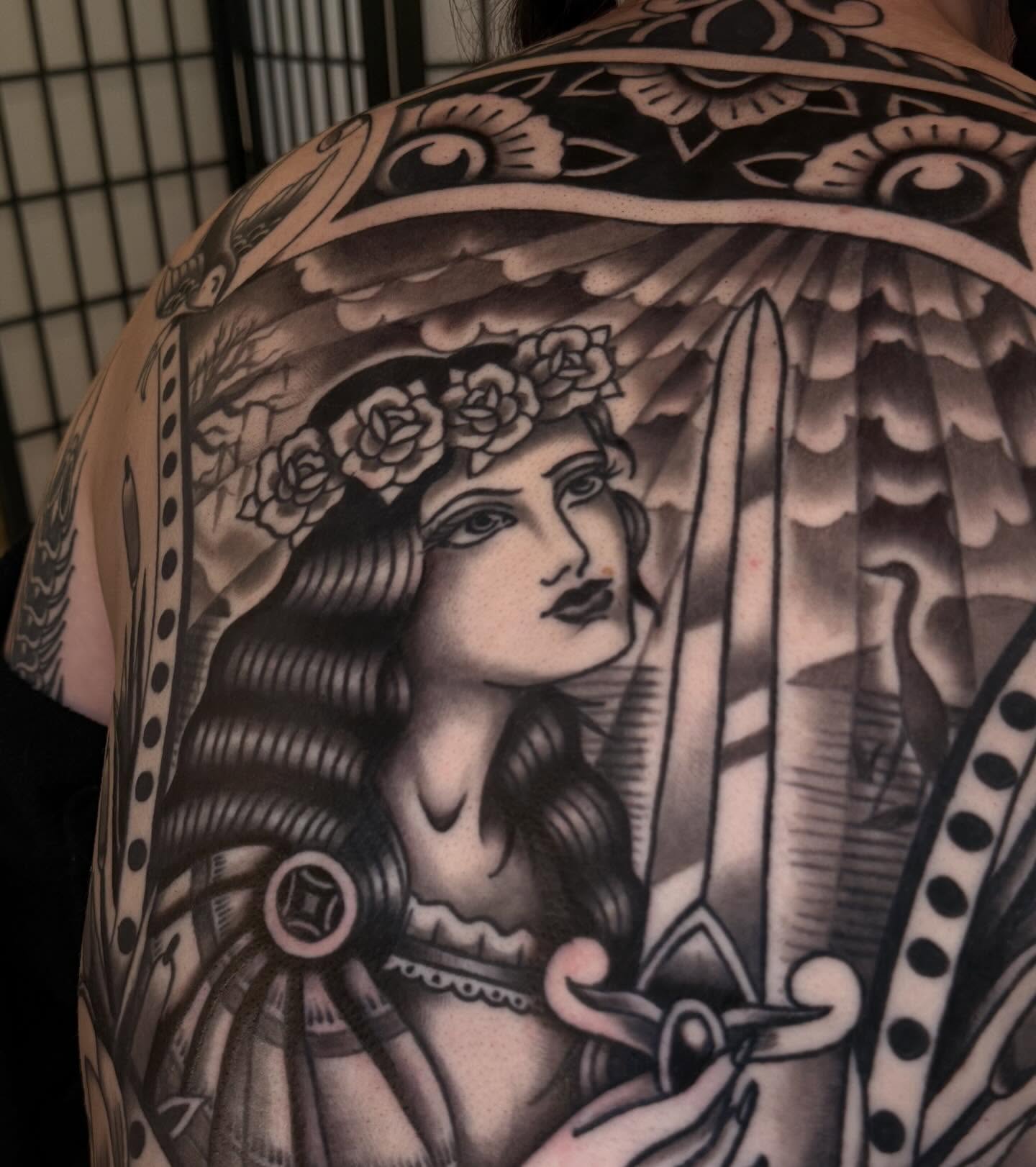 Woman with roses American traditional tattoo on the back by Cory Allen
