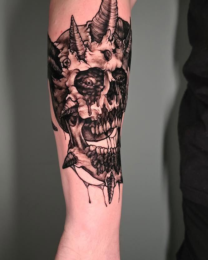Skull realism tattoo on the forearm by Tank Maass
