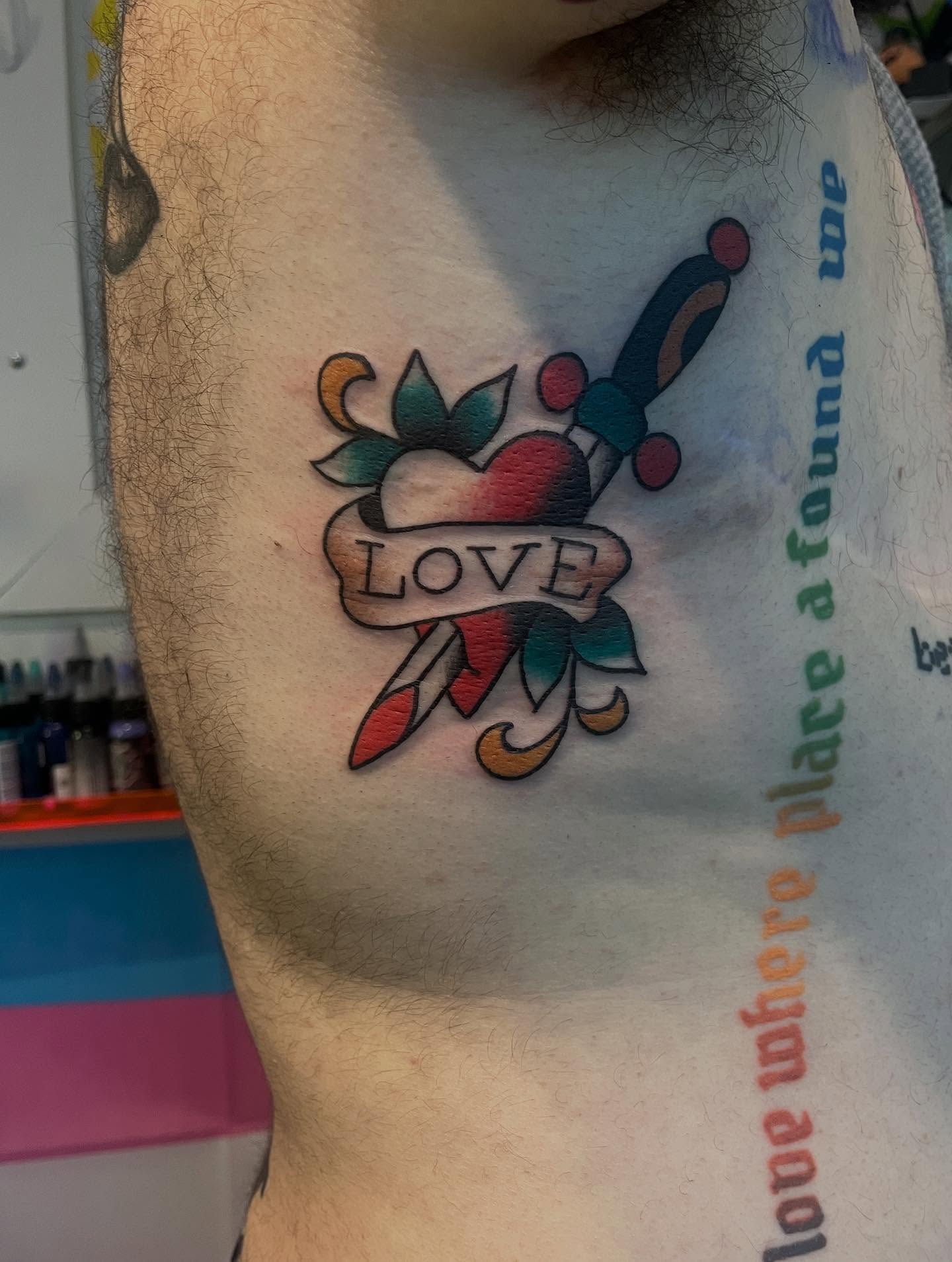 Heart and dagger American traditional tattoo on the chest by 🖤Jess Pereira🖤, Framingham, Massachusetts
