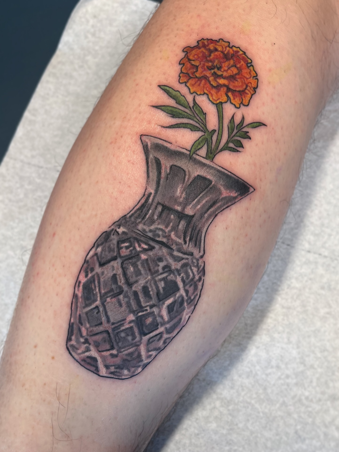 Vase with flower black and grey tattoo on the forearm by Allyson Blessing Tattoos