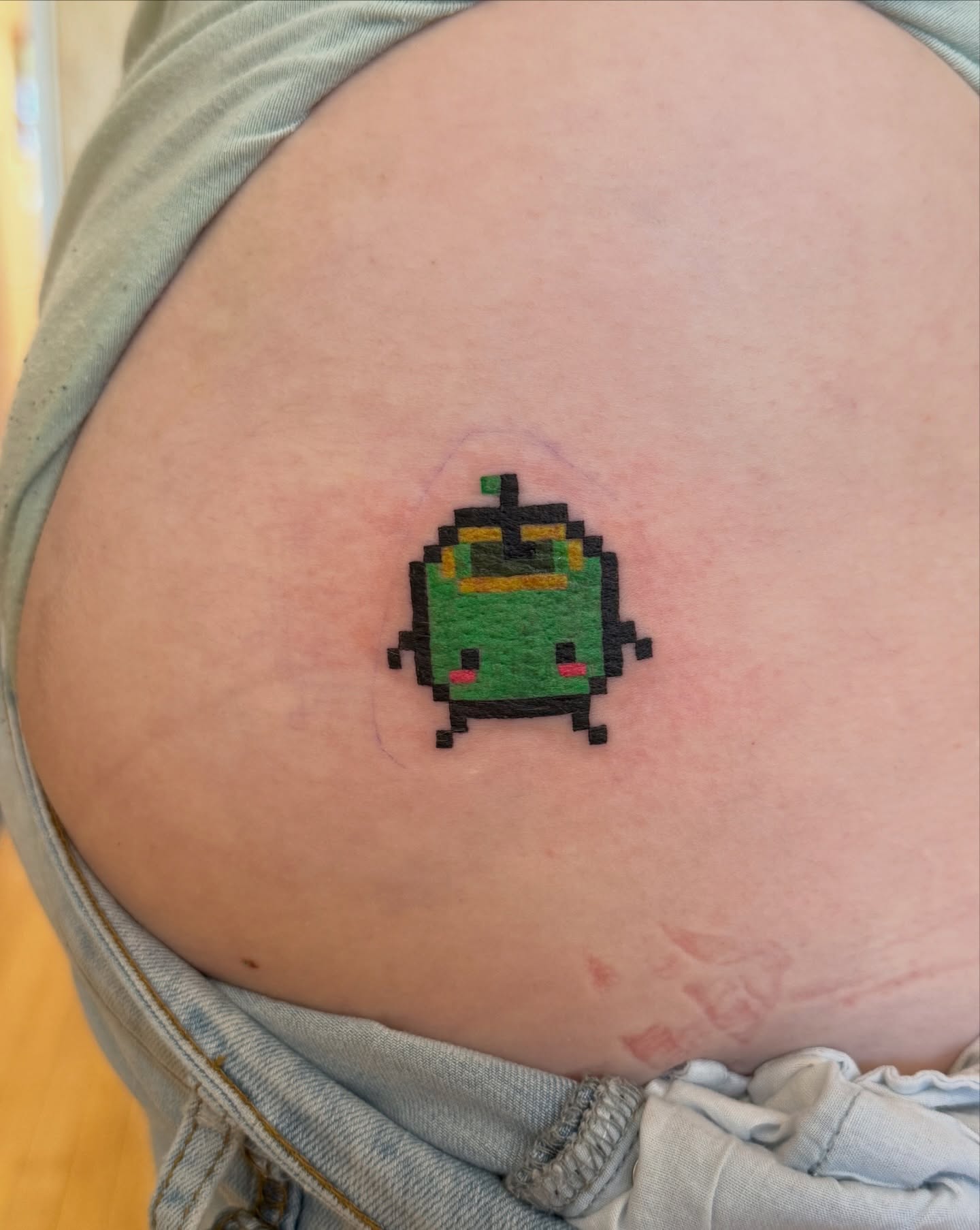 Pixel art robot tattoo on the torso by Kelsey Lynn▪️Raleigh Tattoo Artist