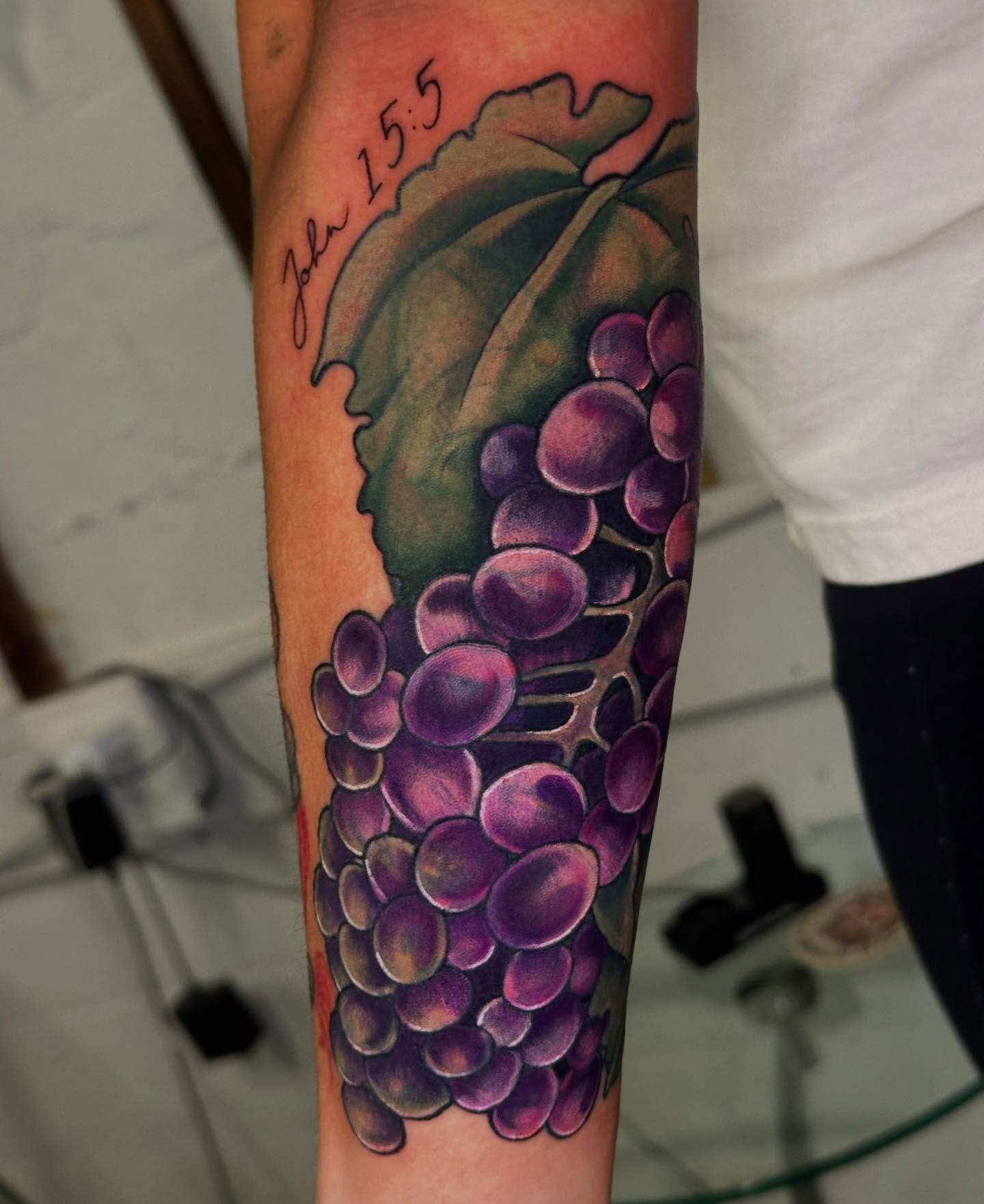 Grapes realism tattoo on the forearm by 𝕳𝖆𝖓𝖓𝖆𝖍 𝕮𝖆𝖓𝖋𝖎𝖊𝖑𝖉 ✨ Memphis Tattoo Artist, Memphis, Tennessee