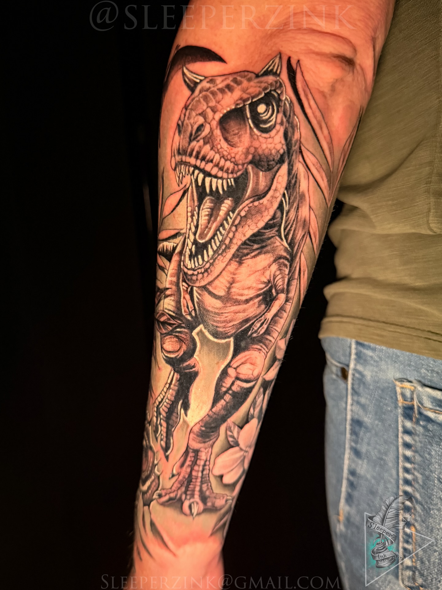 T-Rex realism tattoo on the forearm by Travis Sleeper