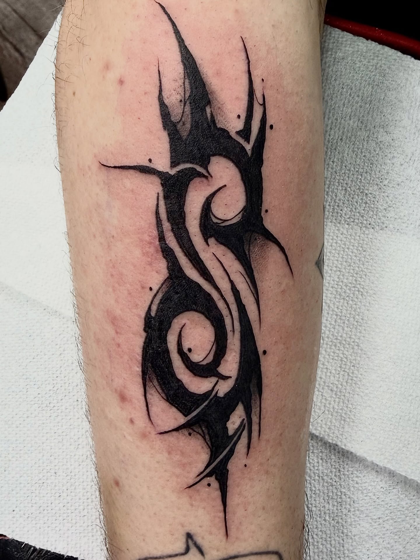 Tribal design tribal tattoo on the forearm by Josh Kronauer