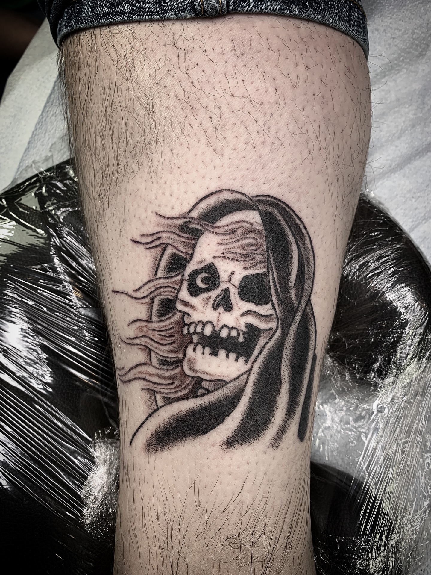 Skull and hooded figure black and grey tattoo on the forearm by Destroy Troy