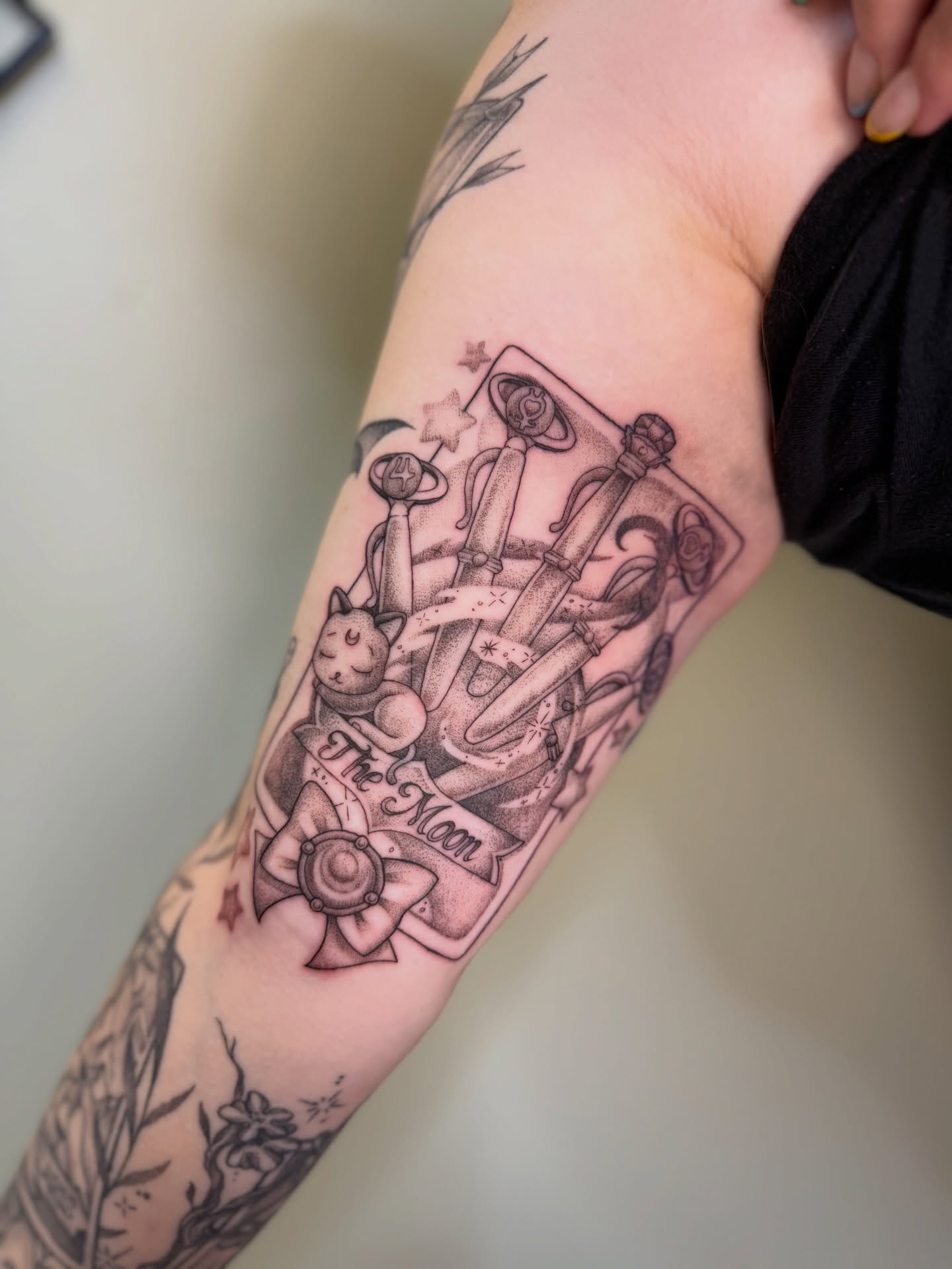 Tarot card black and grey tattoo on the forearm by Koryn Donnelly