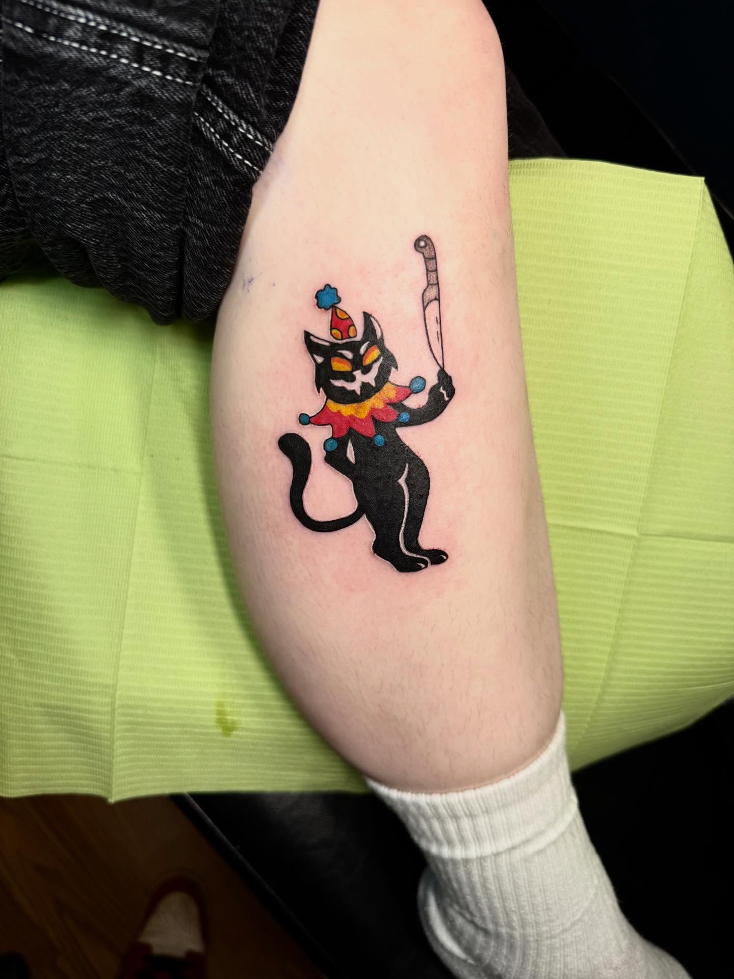 Clown cat American traditional tattoo on the forearm by Max