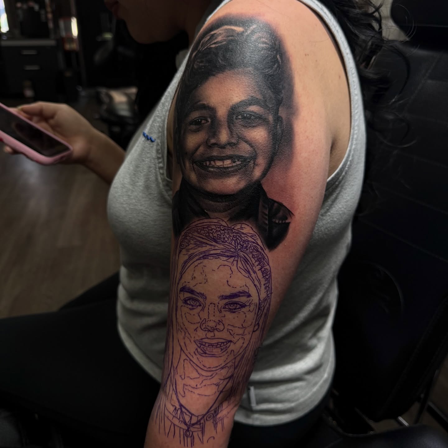 Portrait realism tattoo on the upper arm by Nathan Guerrero