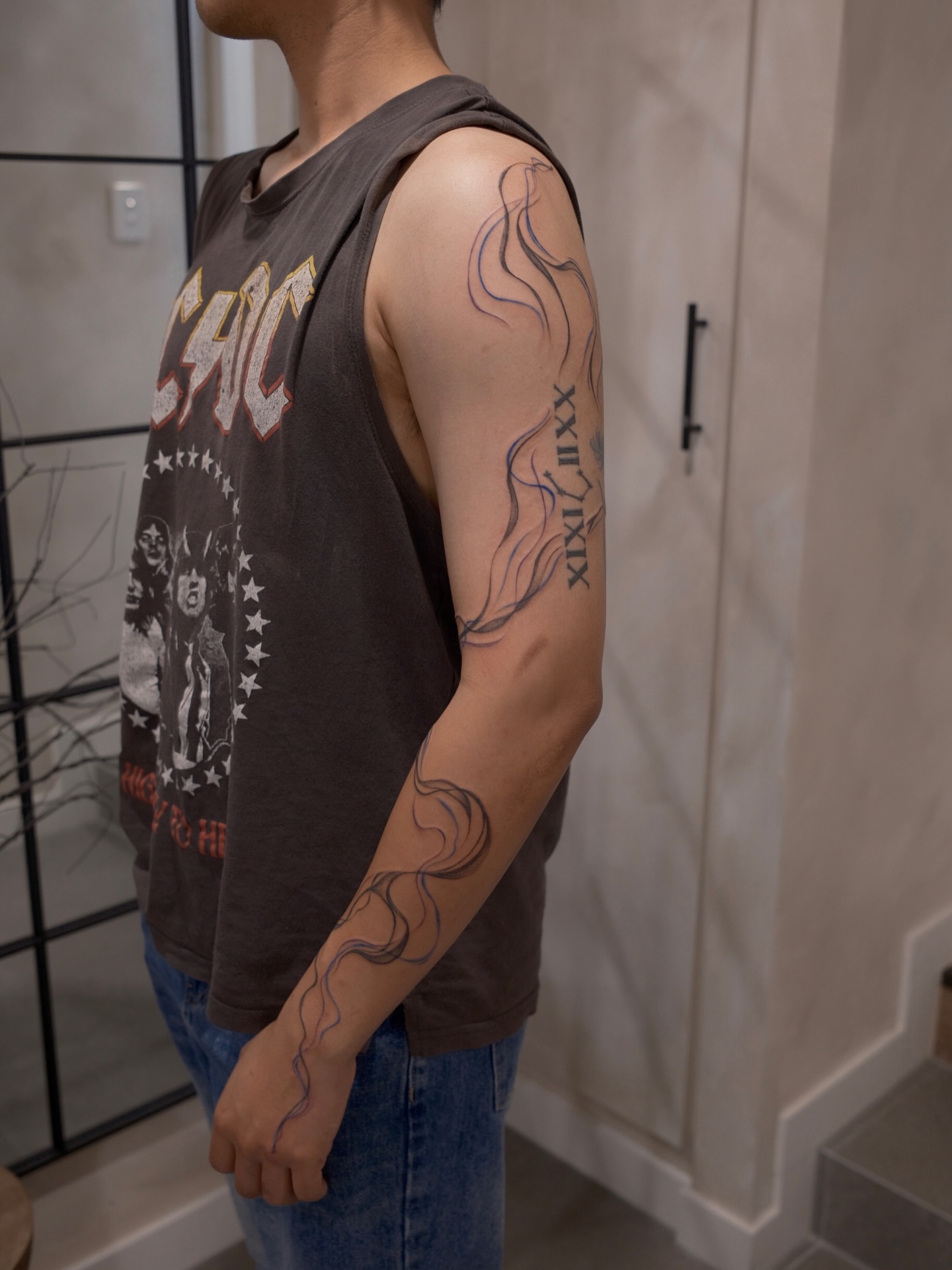Flame black and grey tattoo on the forearm by Joy, Gold Coast, Queensland