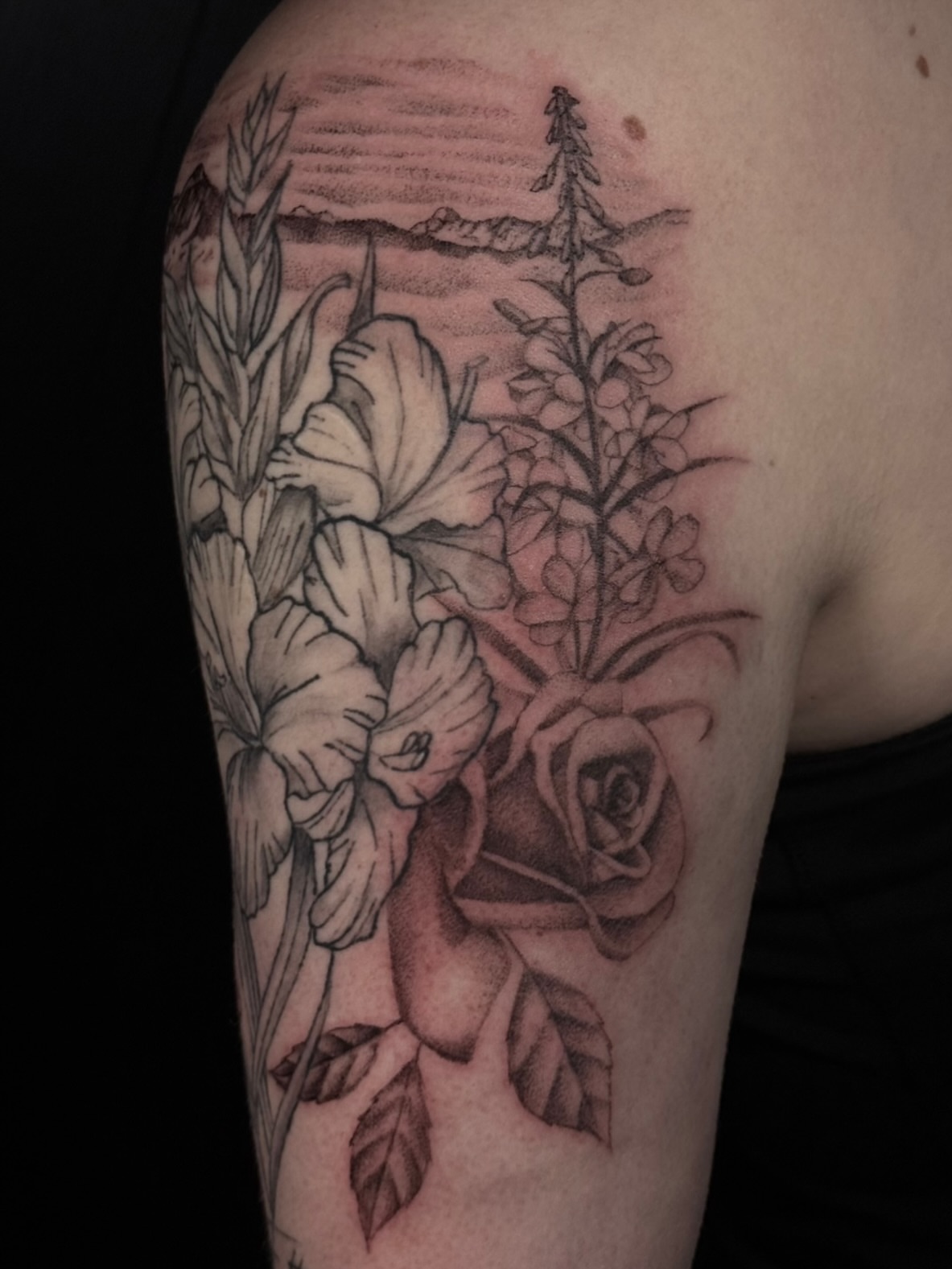 Floral landscape realism tattoo on the upper arm by Alyssa Fazzino ⟡ CT Tattoo Artist, Rocky Hill, Connecticut