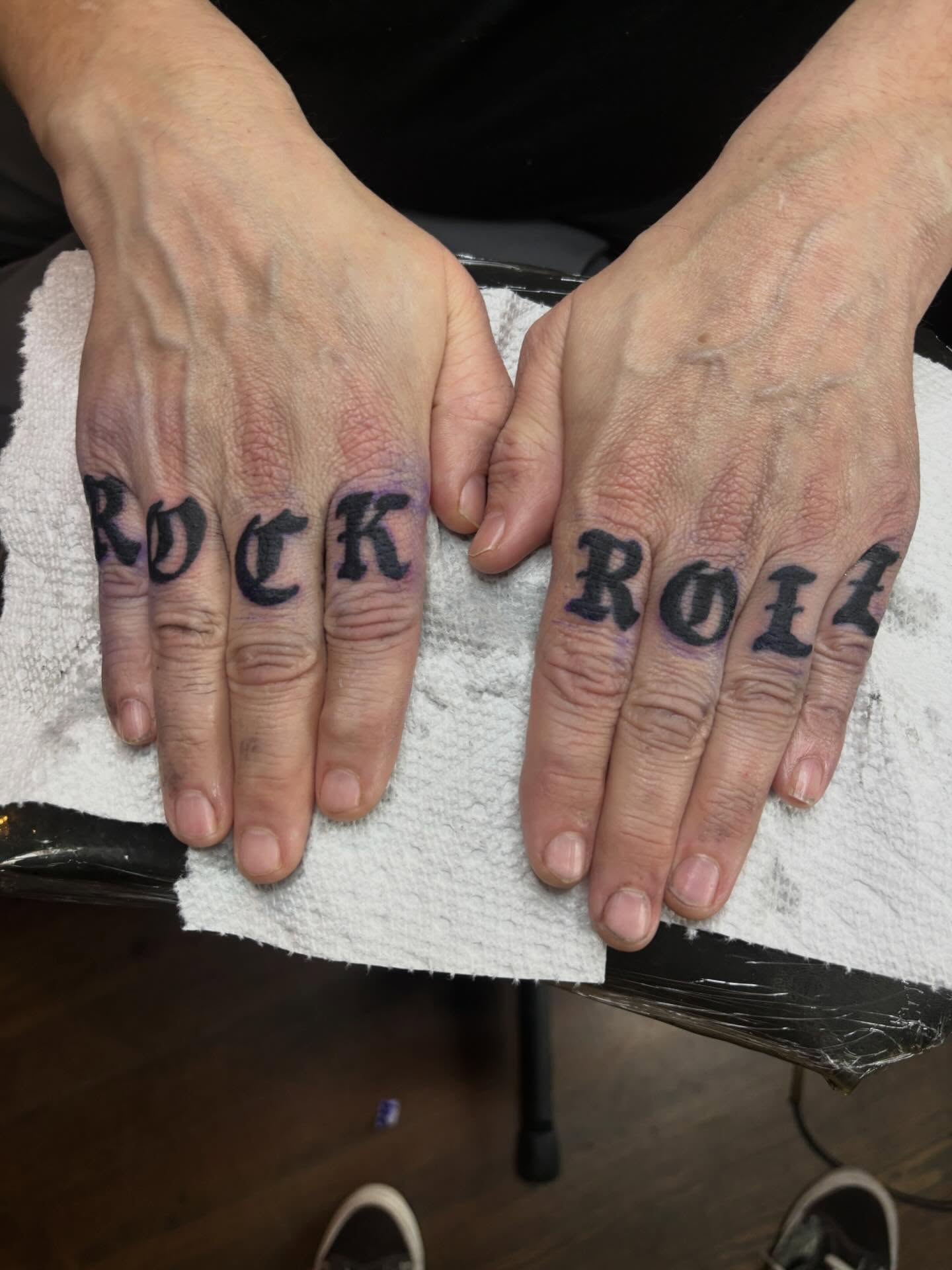 Finger lettering lettering script tattoo on the hand by Mitch Ashpaugh