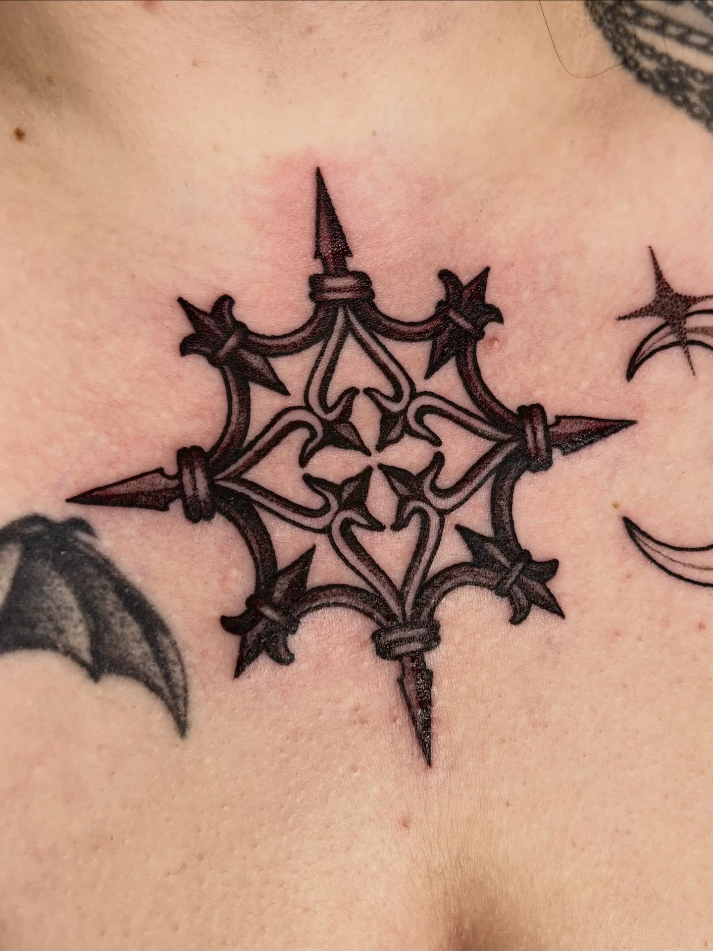 Geometric star geometric tattoo on the chest by Tara, Exeter, Pennsylvania