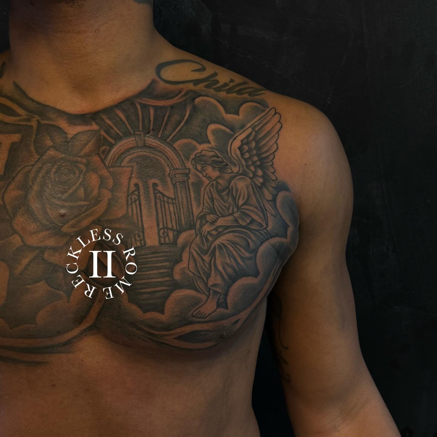 Angel and rose realism tattoo on the chest by Rome