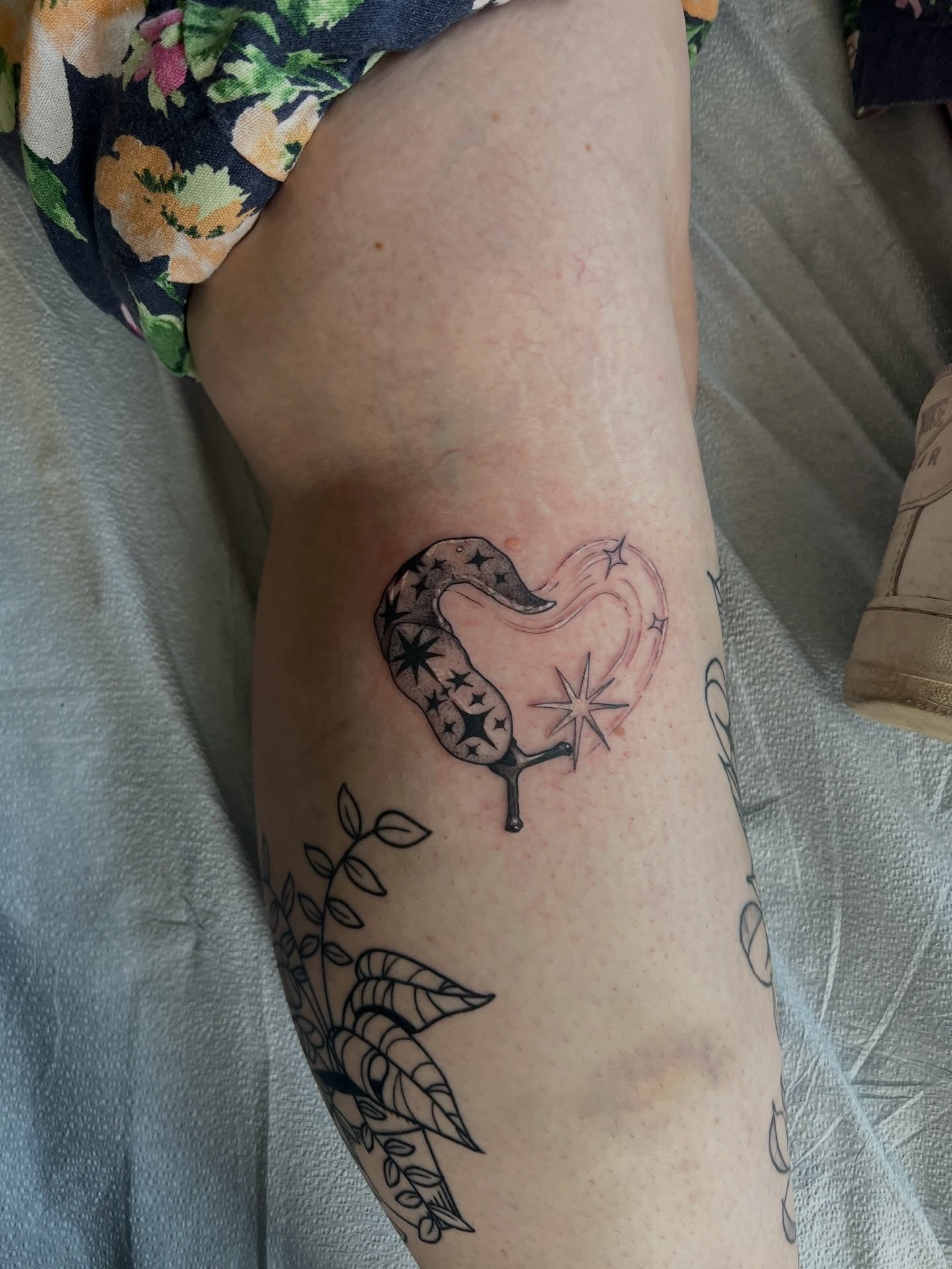 Heart with stars black and grey tattoo on the forearm by Jeremy Wiscombe