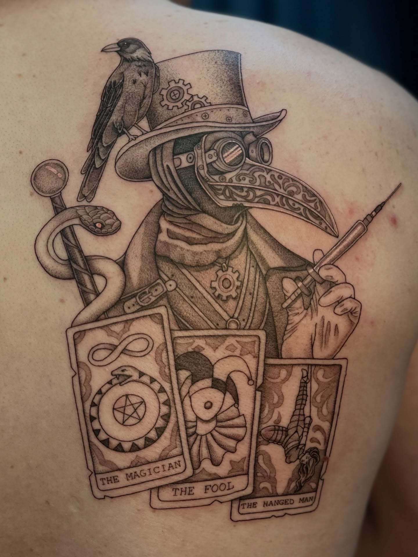 Plague doctor with tarot cards realism tattoo on the shoulder by Ghost
