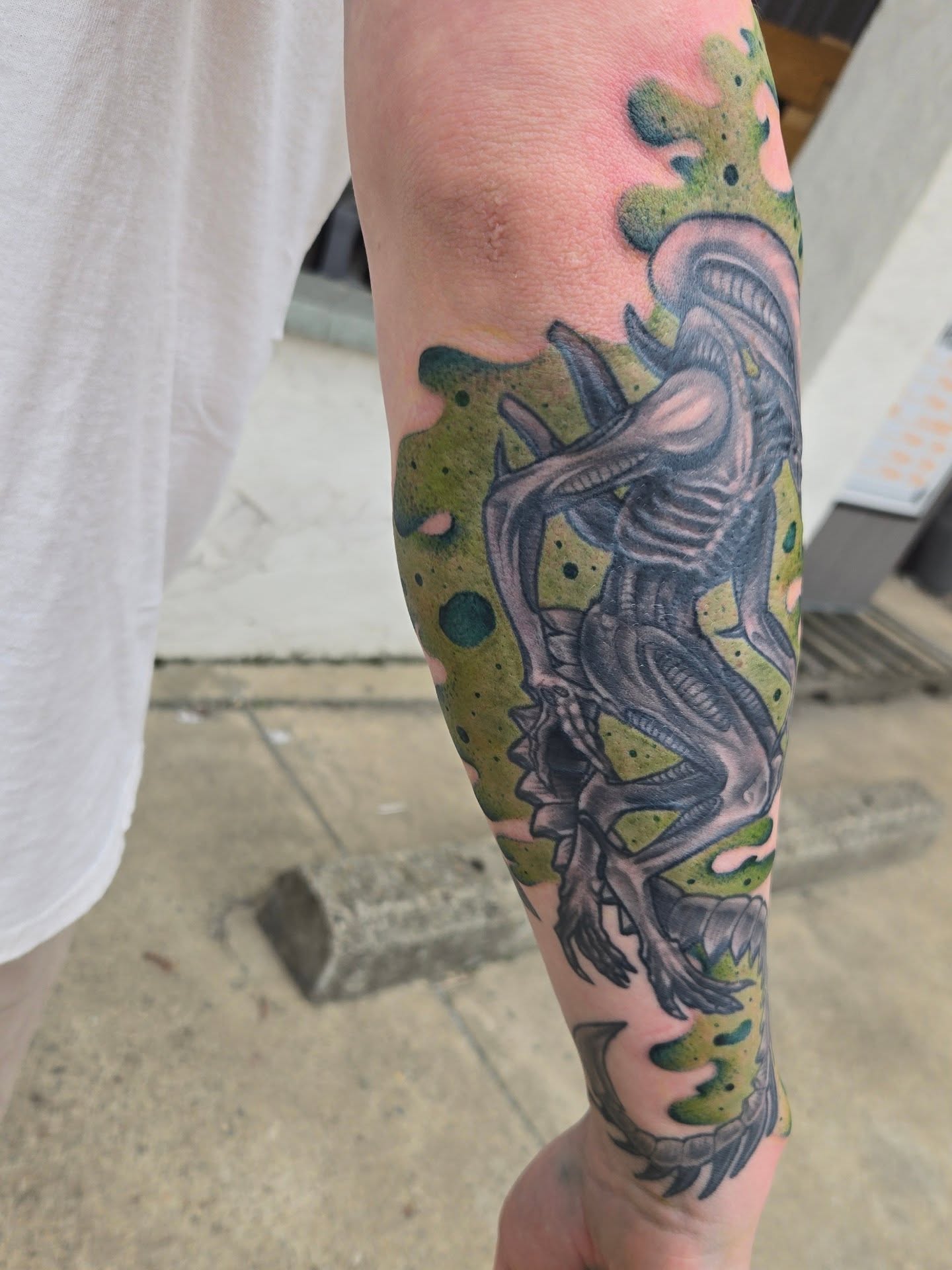 Alien creature new school tattoo on the forearm by Angel O'Connor Tattoos