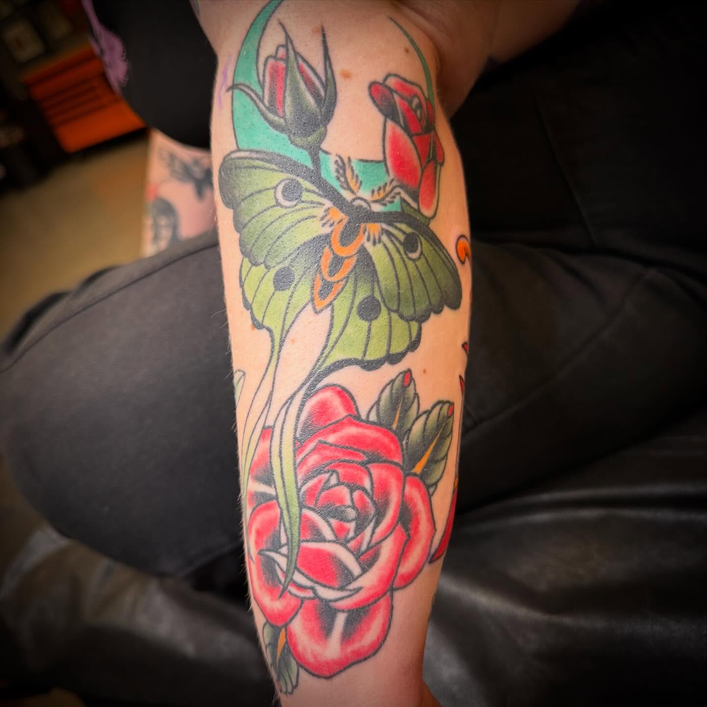 Roses and butterfly American traditional tattoo on the forearm by ArJay Smith