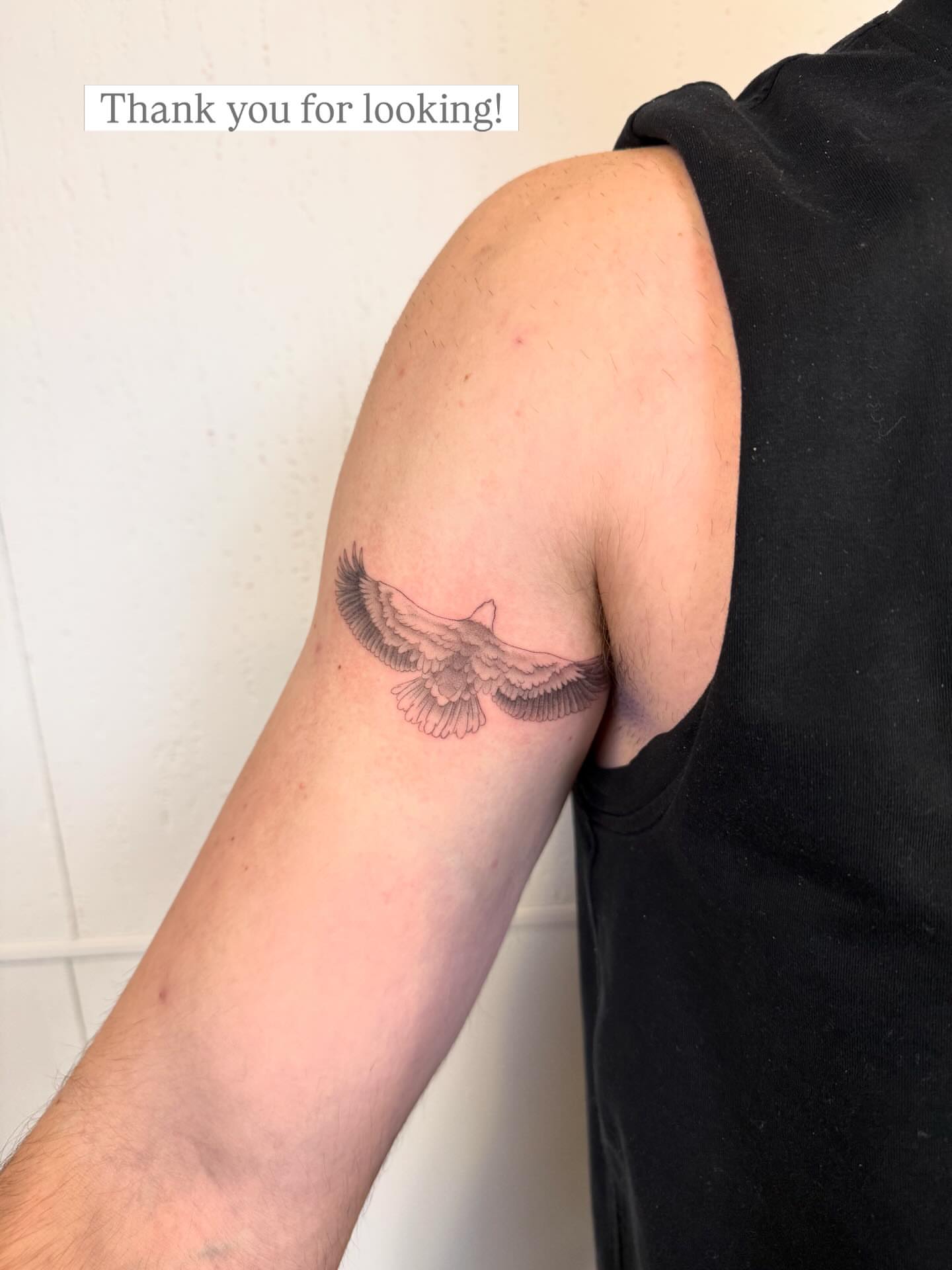 Eagle black and grey tattoo on the forearm by Justin Turkus