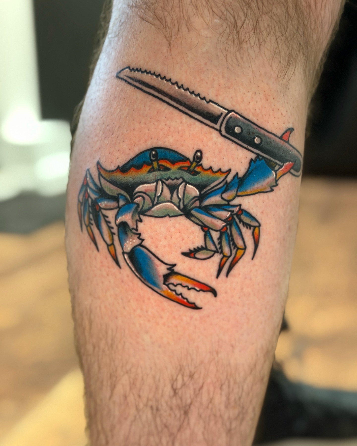 Crab and knife American traditional tattoo on the forearm by R e N O T
