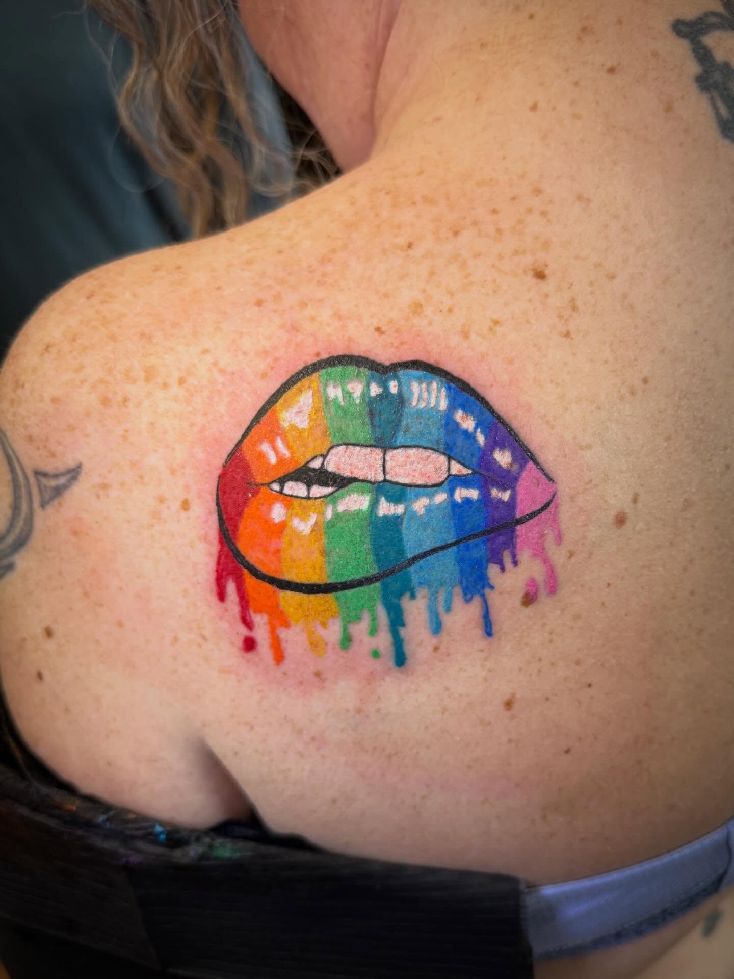 Rainbow lips new school tattoo on the shoulder by Mikey