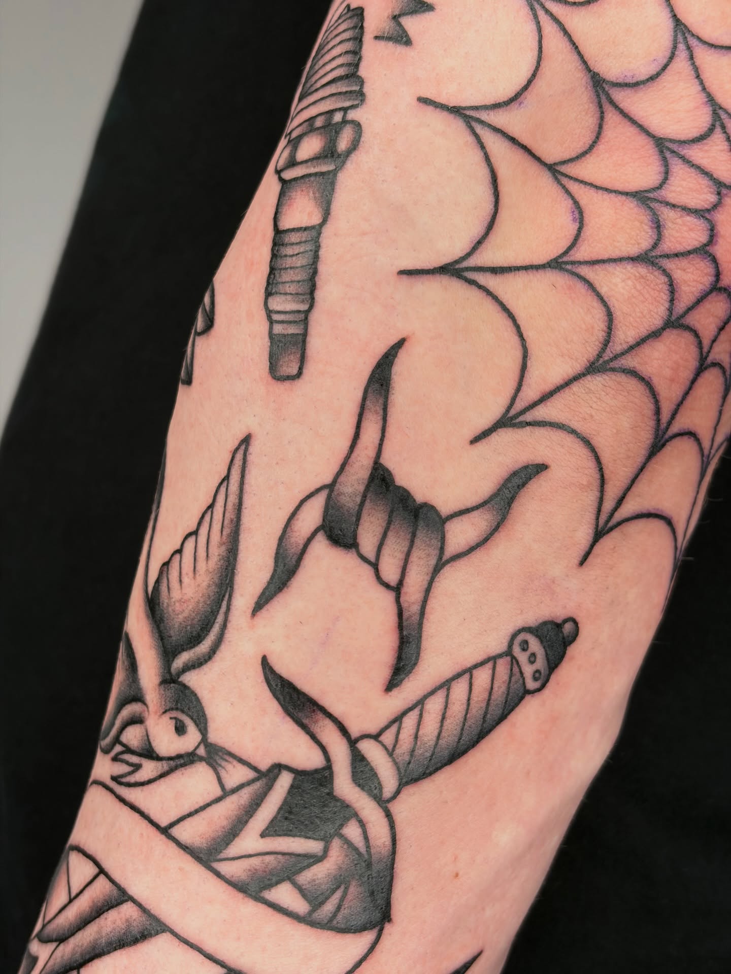 Spiderweb and dagger black and grey tattoo on the forearm by Poppy Olivia Deards