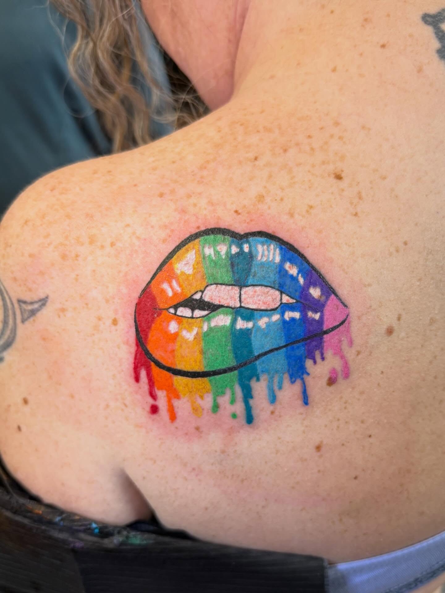 Rainbow lips new school tattoo on the shoulder by Mikey