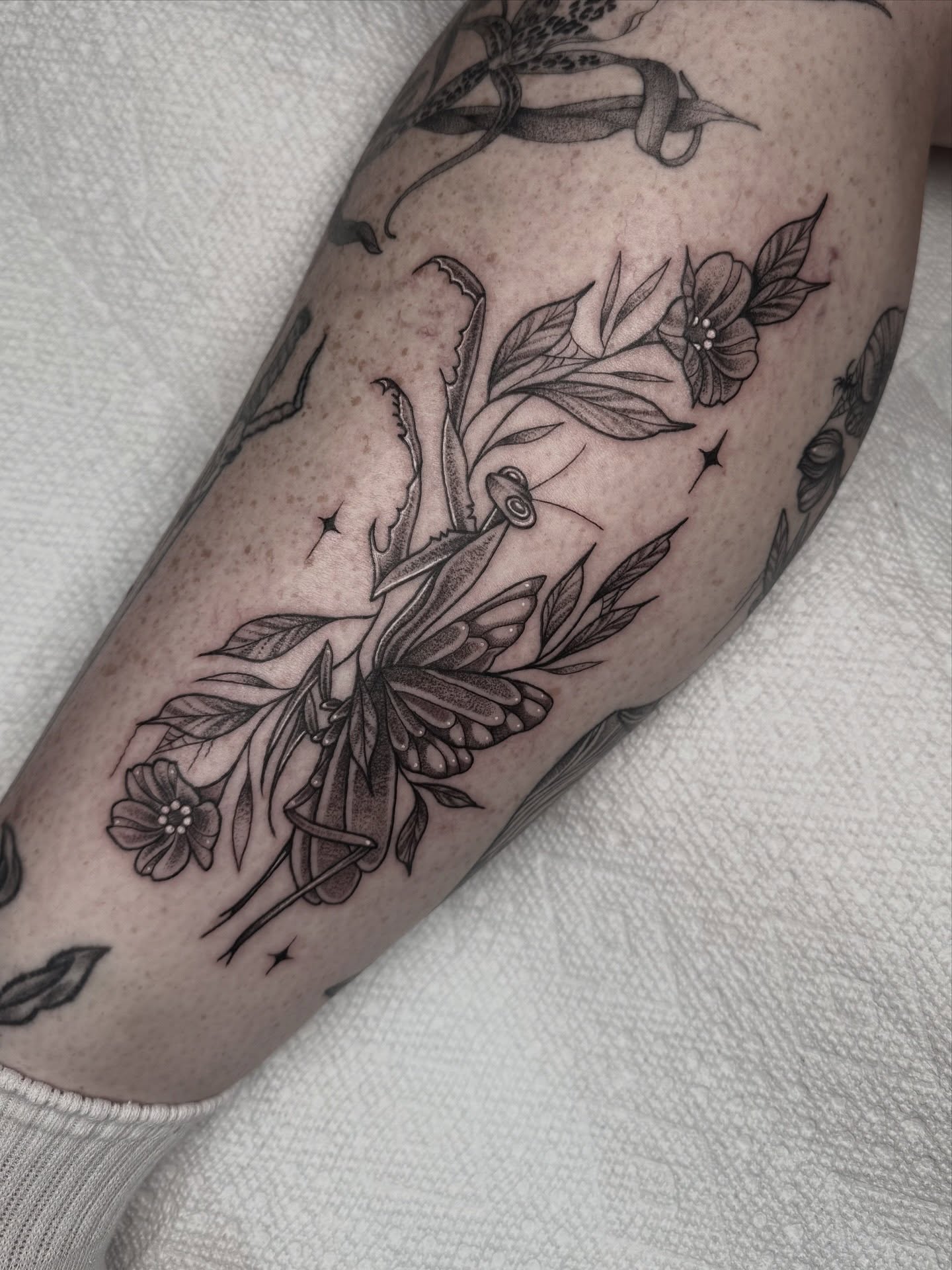 Butterfly and flowers black and grey tattoo on the forearm by Mara Flores βπΛβ§