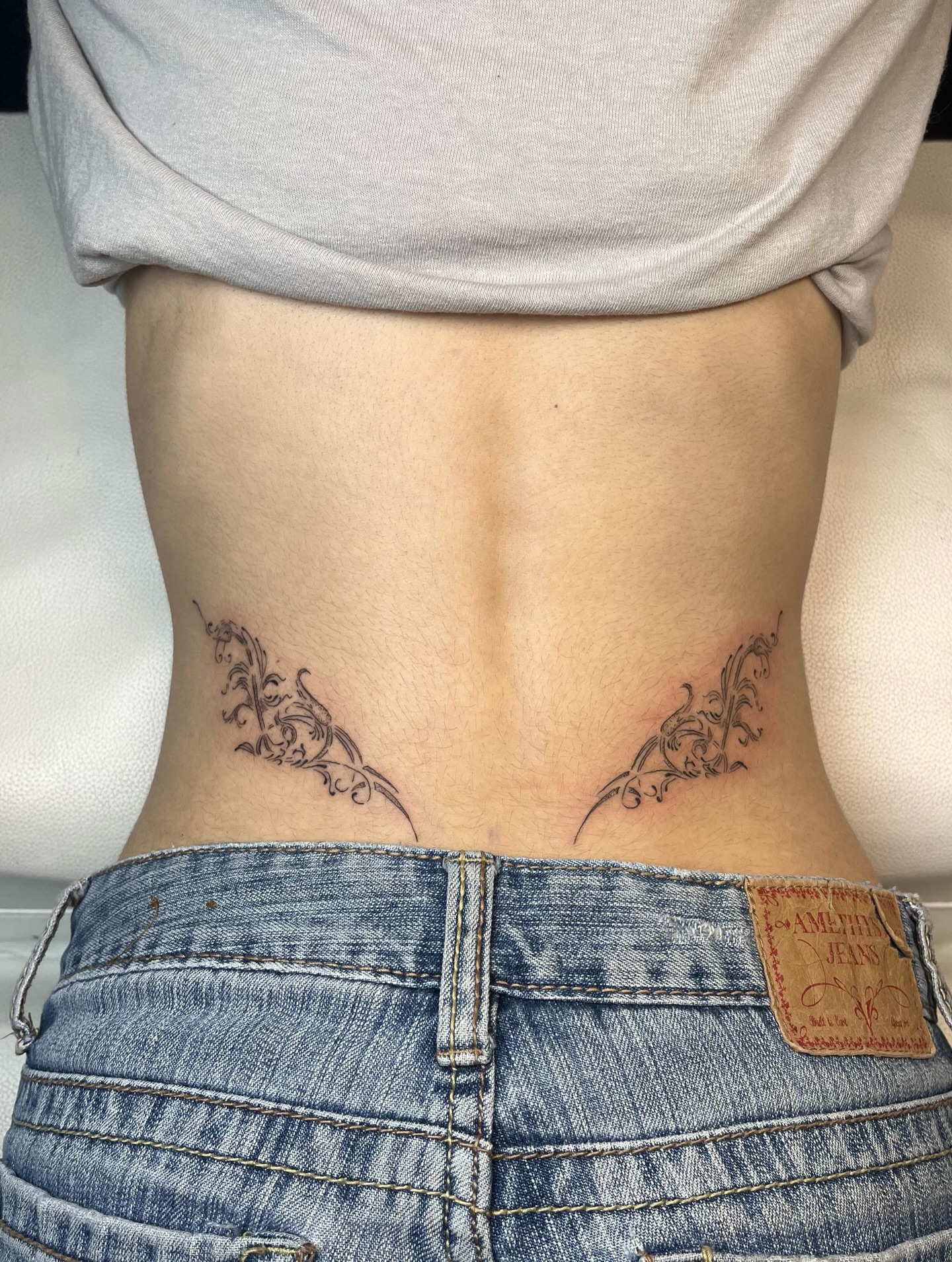 Scrollwork ornamental tattoo on the torso by brinley - fine line tattoos, Crescent Springs, Kentucky