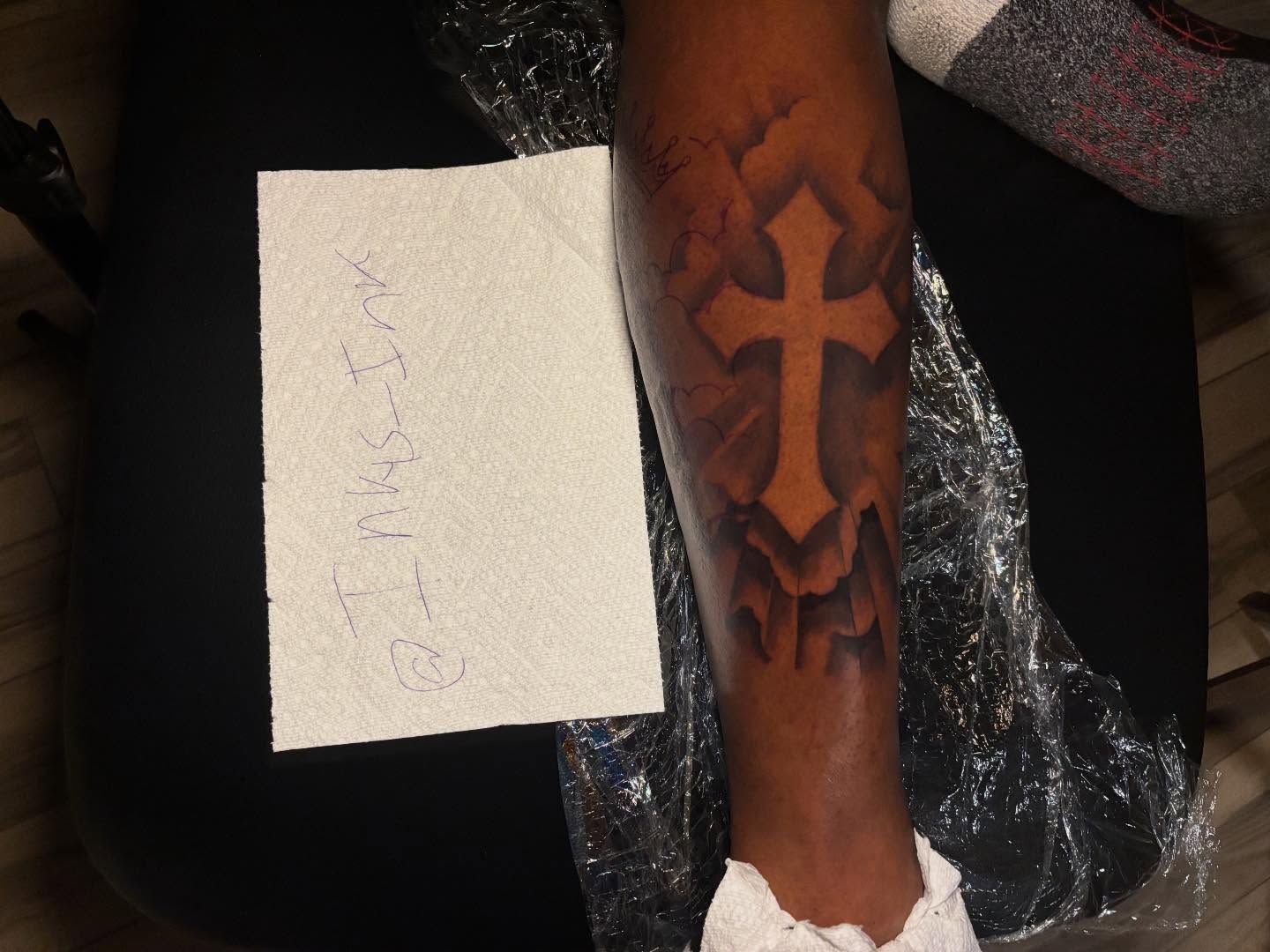 Cross black and grey tattoo on the forearm by Inkys Tatts
