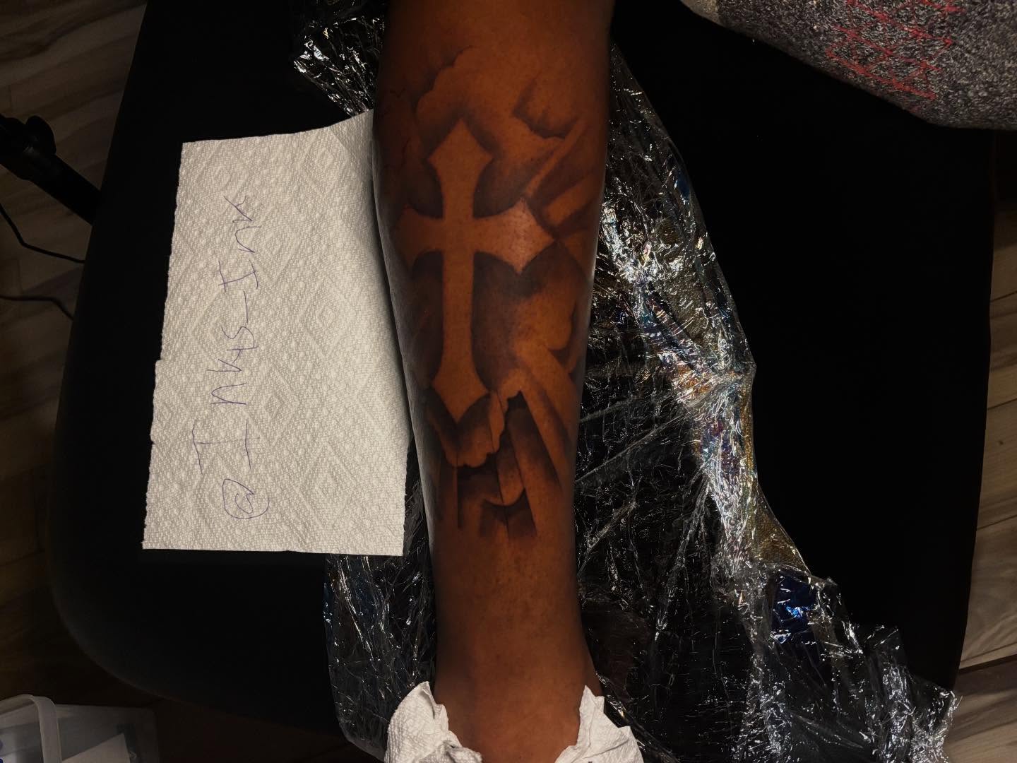 Cross black and grey tattoo on the forearm by Inkys Tatts