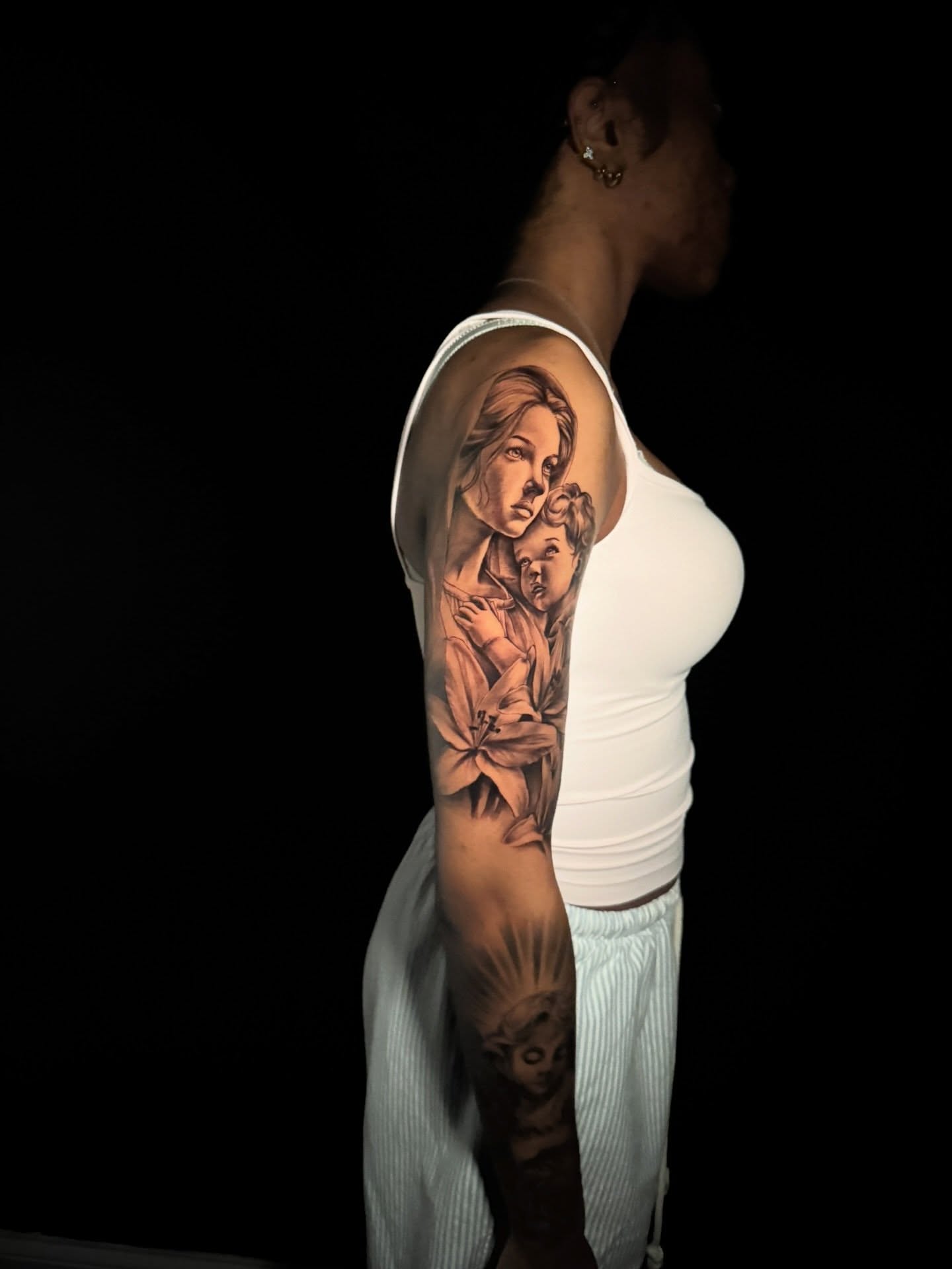 Mother and child realism tattoo on the upper arm by Atl Tattoo Artist✍🏾👨🏾‍🎨
