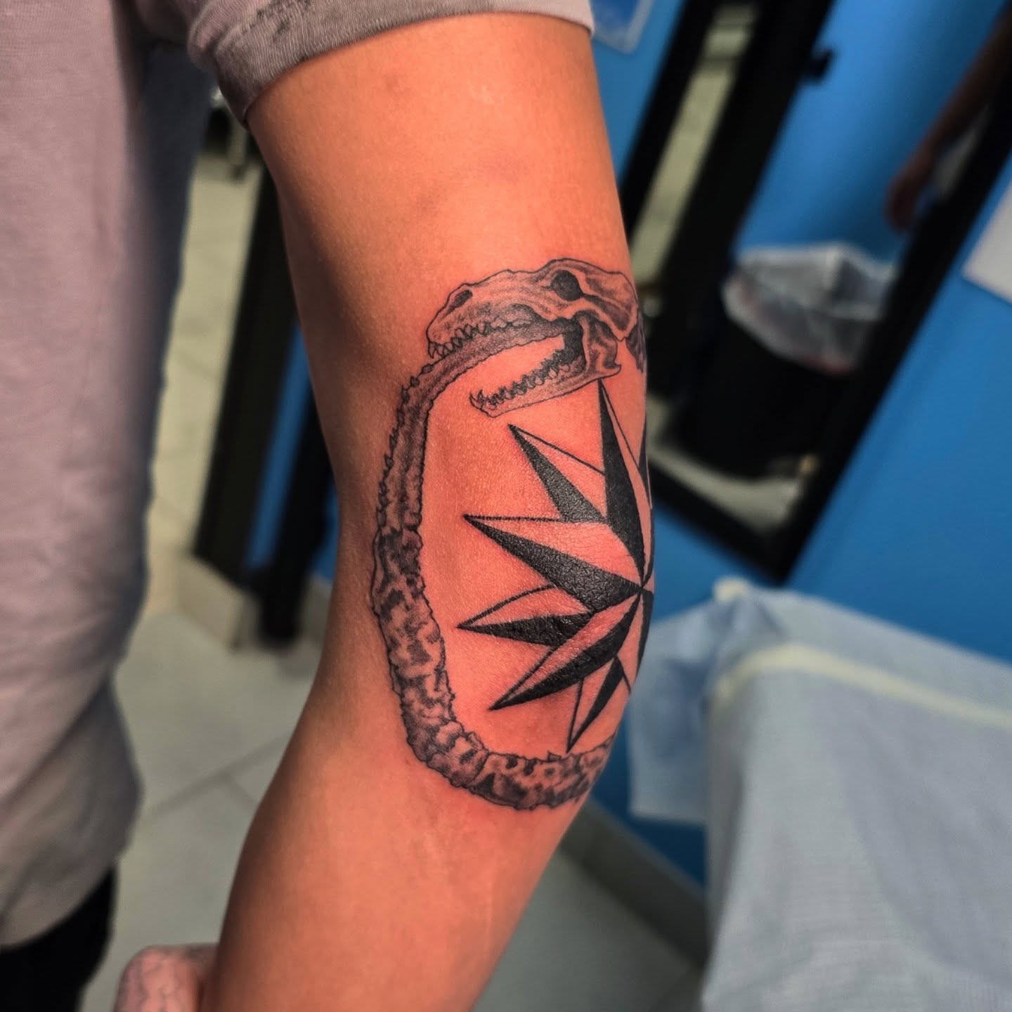 Dinosaur black and grey tattoo on the forearm by "Gentle"Jay Blondel